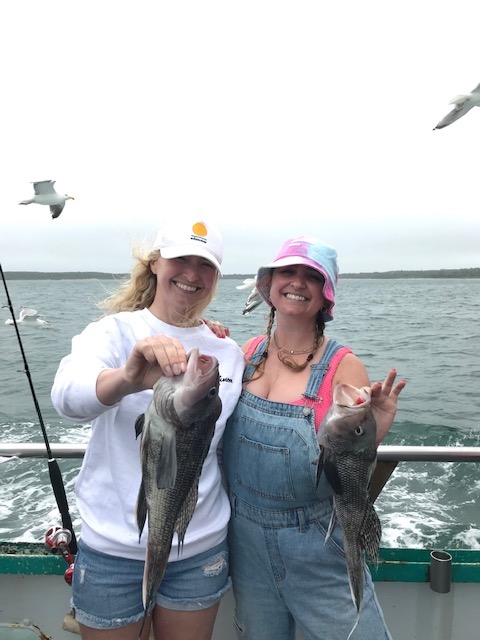 a person holding a fish in the water