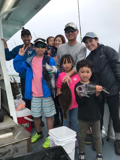 a group of people standing in front of a crowd posing for the camera