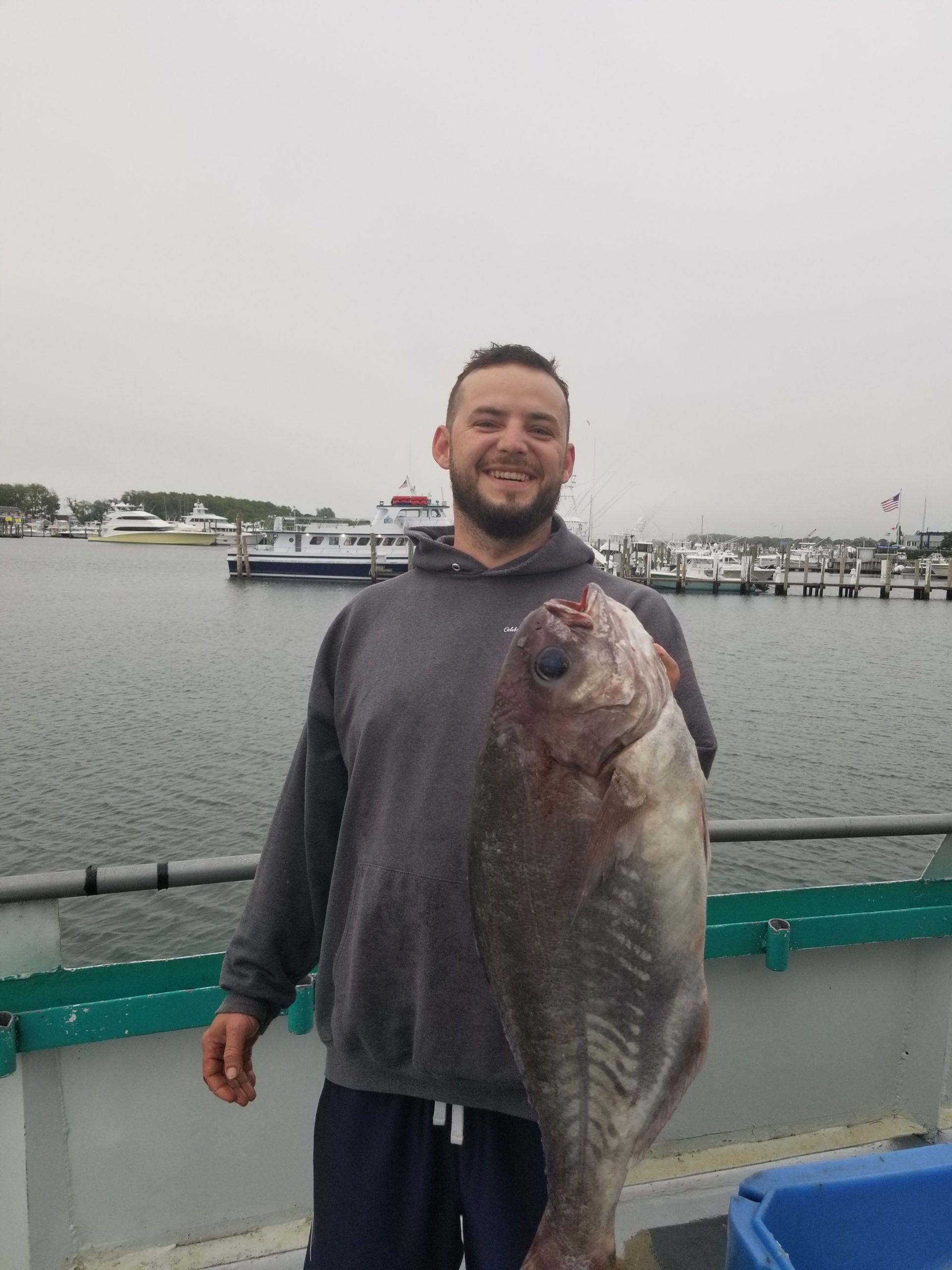 a man holding a fish in the water