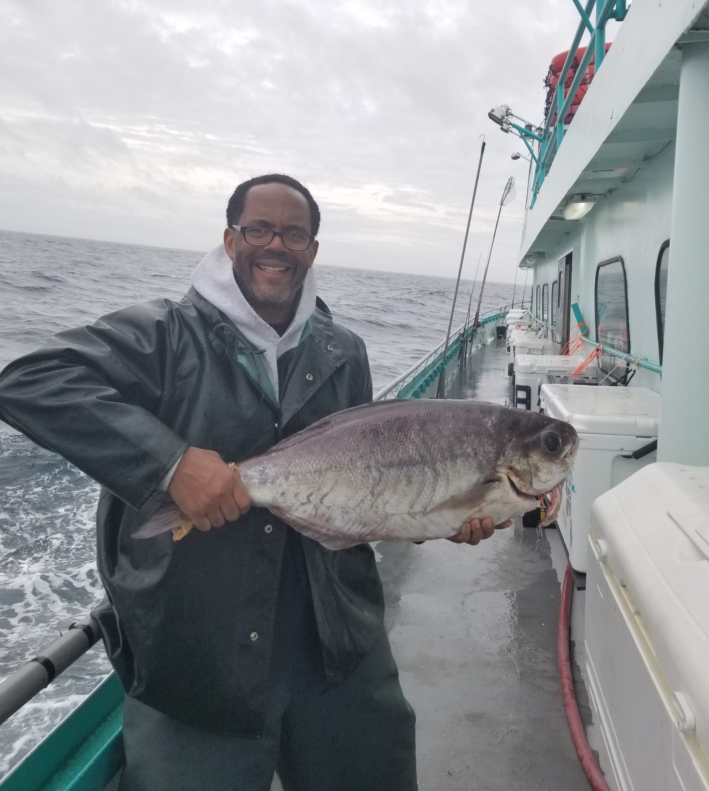 a man holding a fish