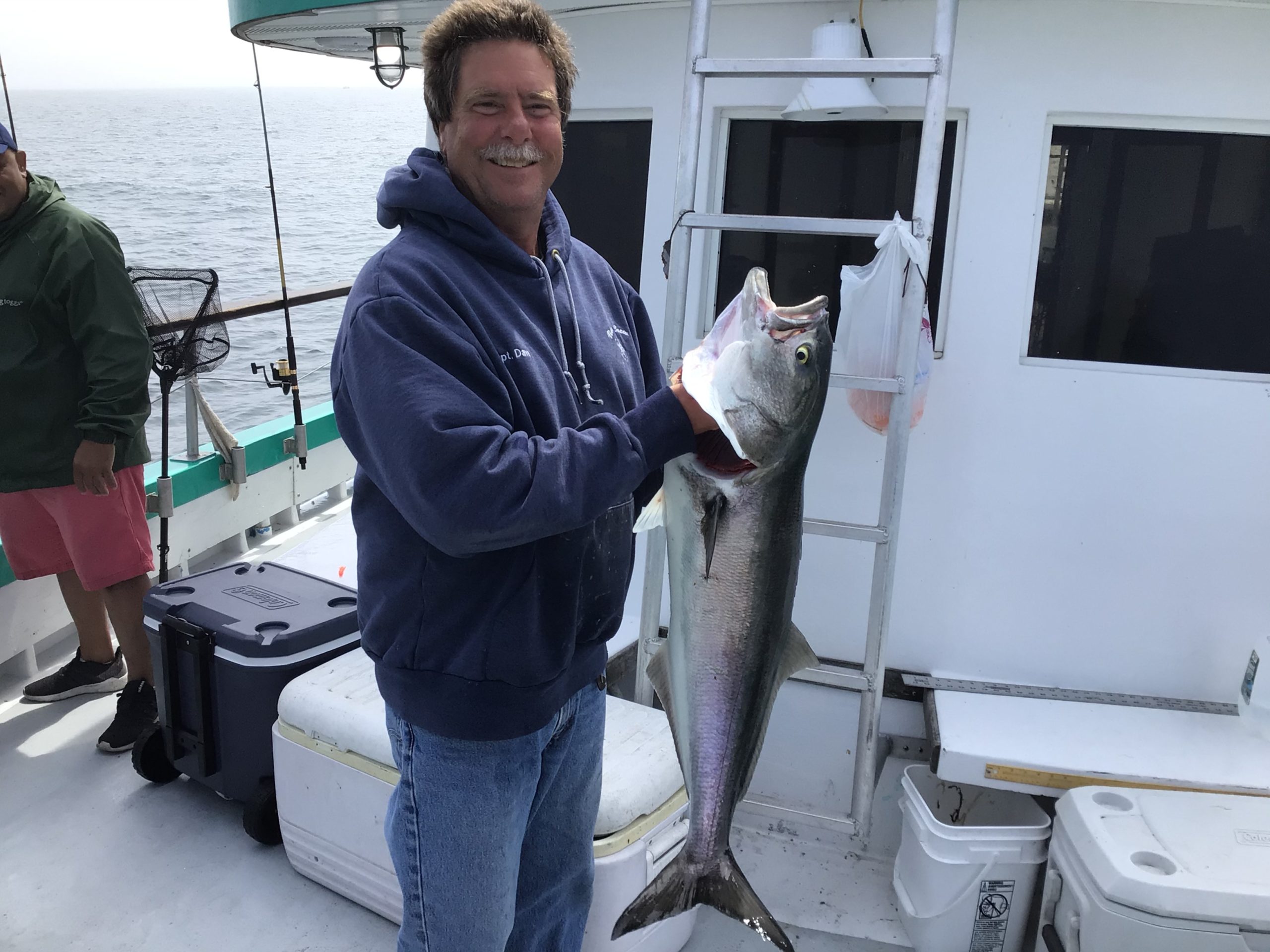 a person holding a fish