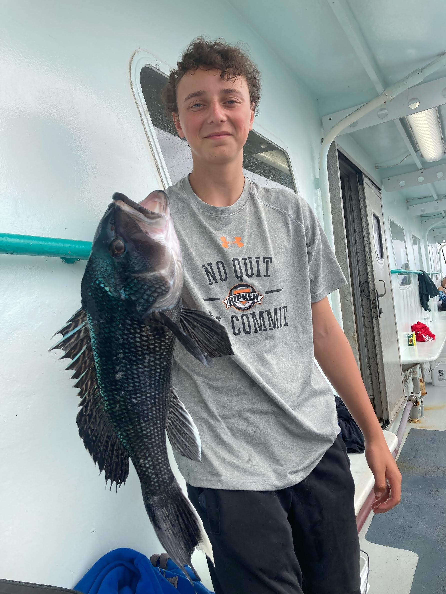 a man holding a fish