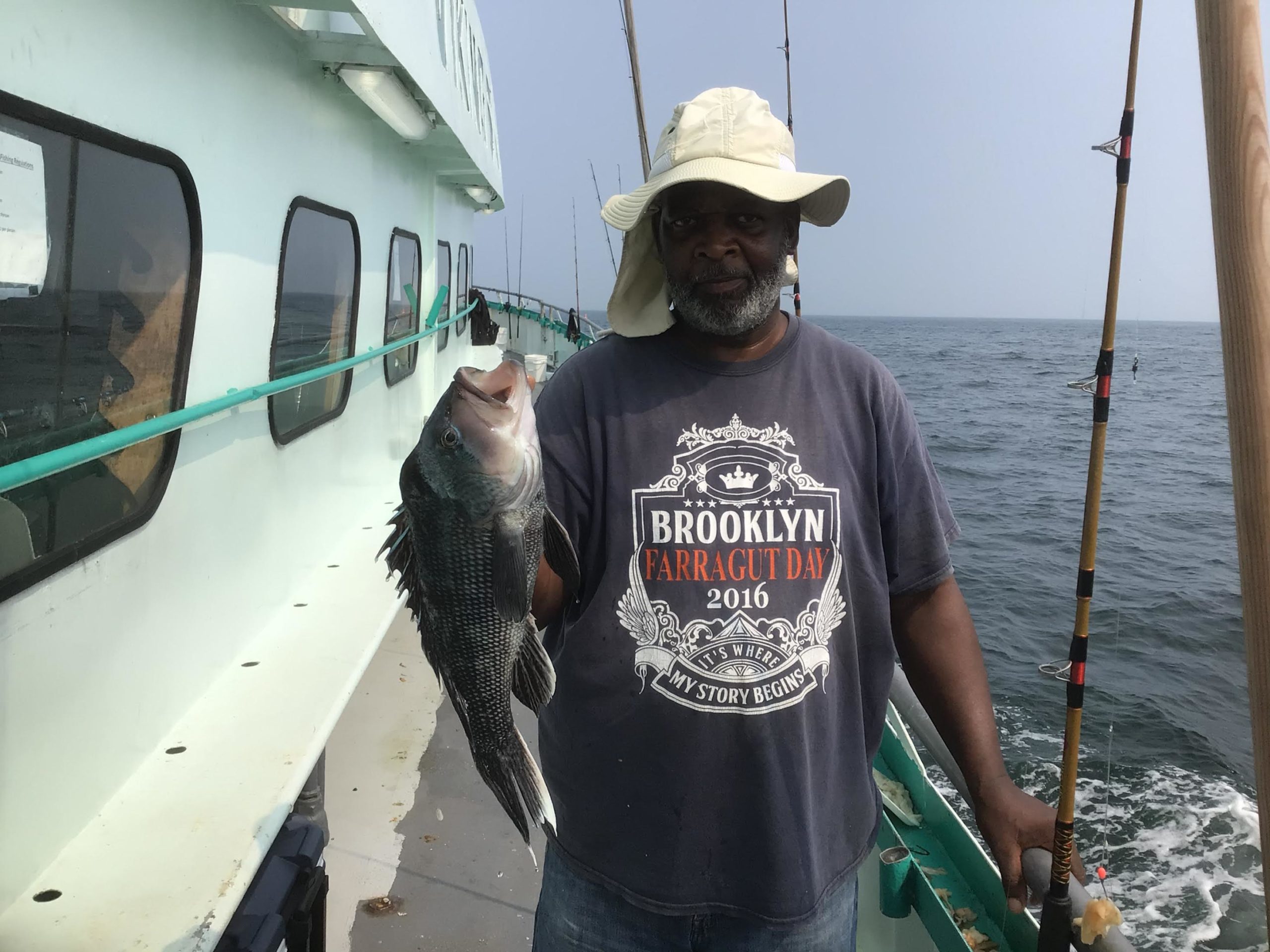 a man holding a fish in the water