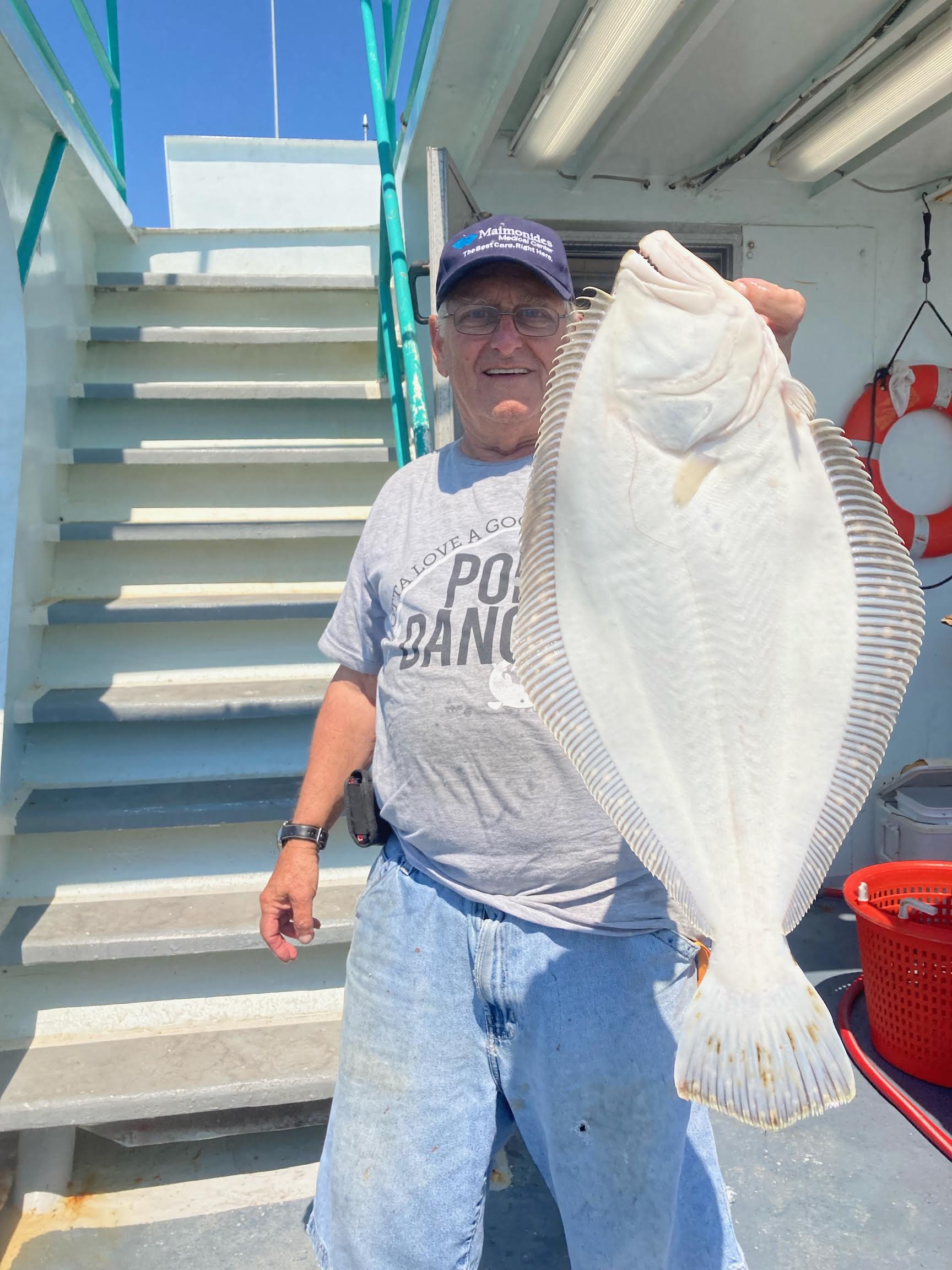 a man holding a fish