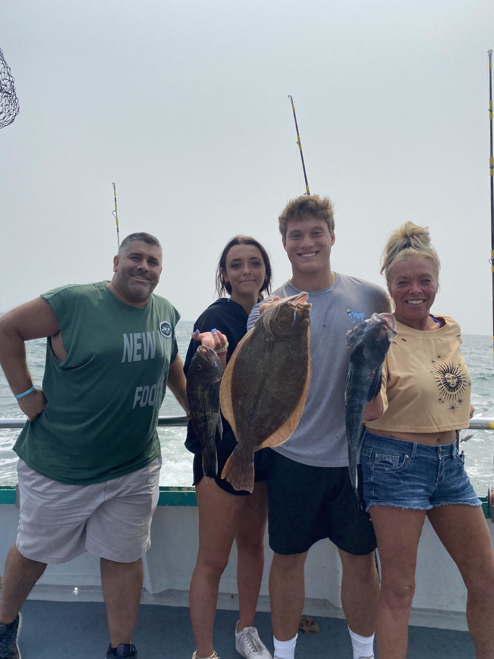 a group of people standing in front of a crowd posing for the camera