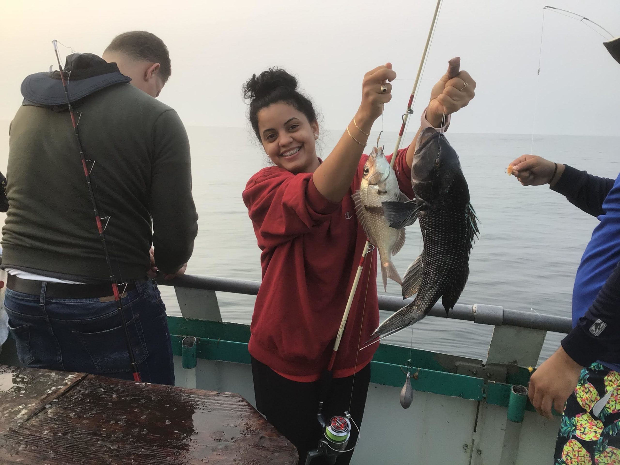 a person holding a fish