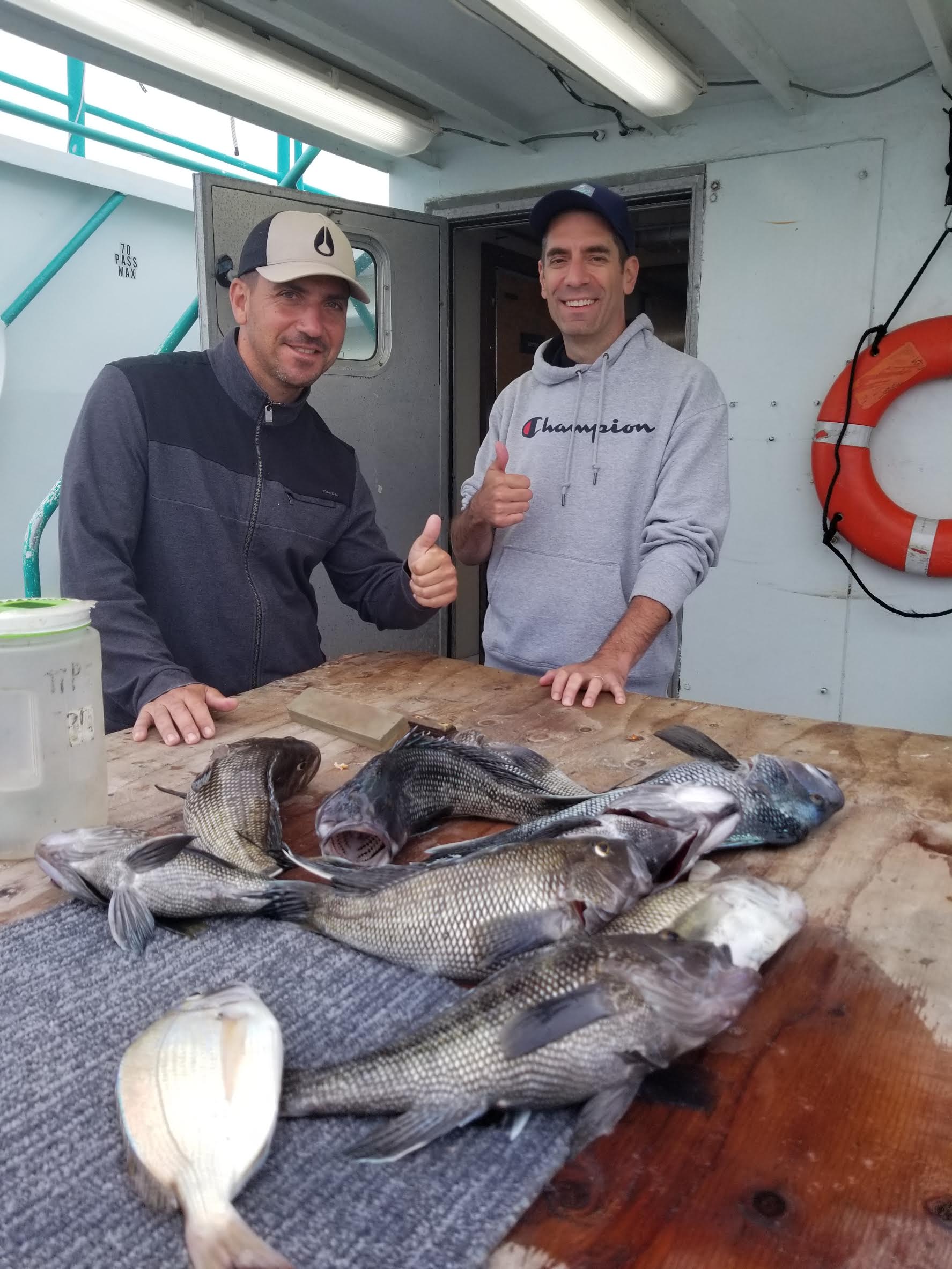 a man sitting on a cutting board