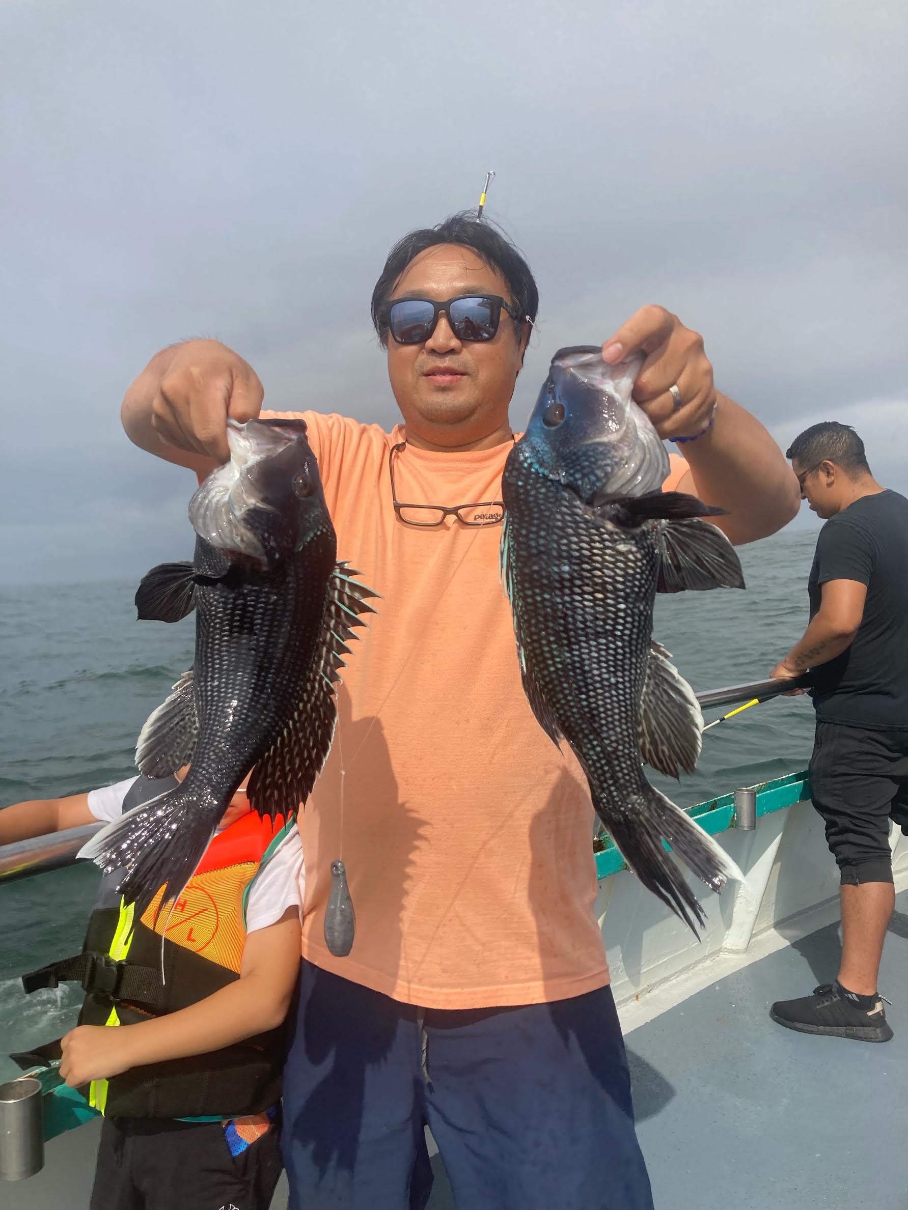 a man holding a fish