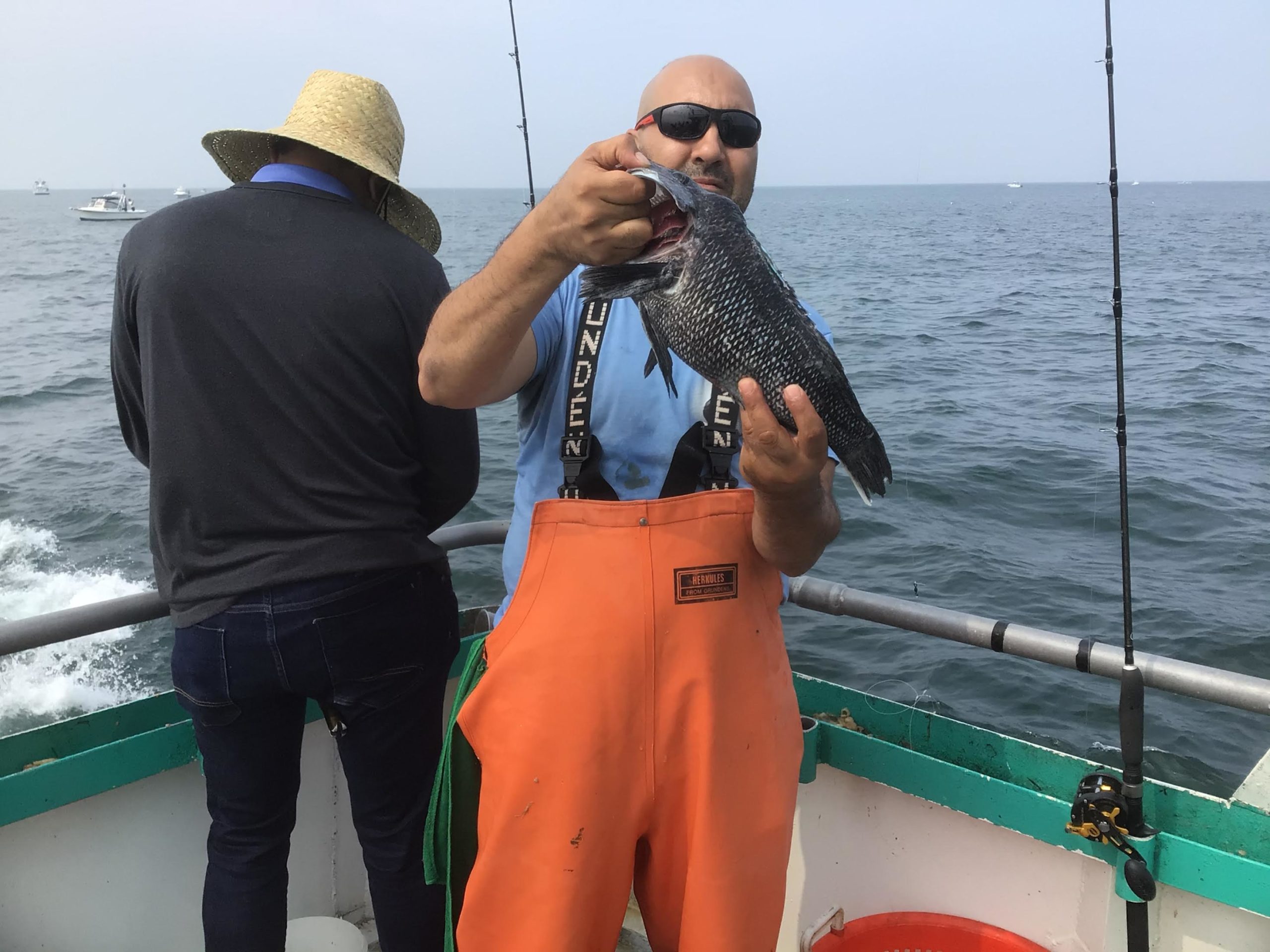 a person standing next to a body of water