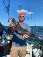 a person holding a fish