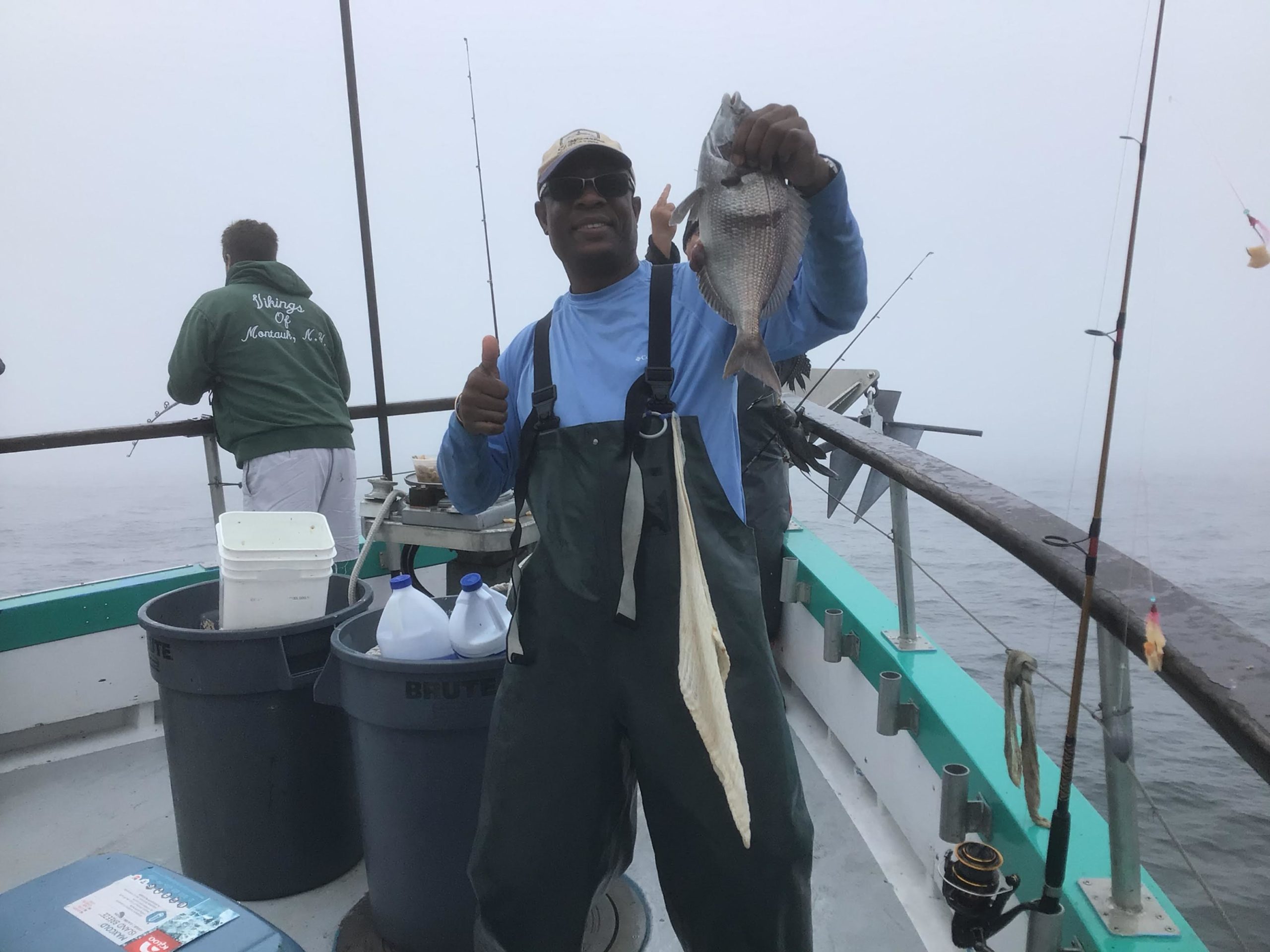 a group of people standing on a boat