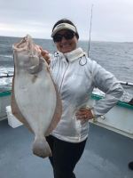 a man holding a fish in the water