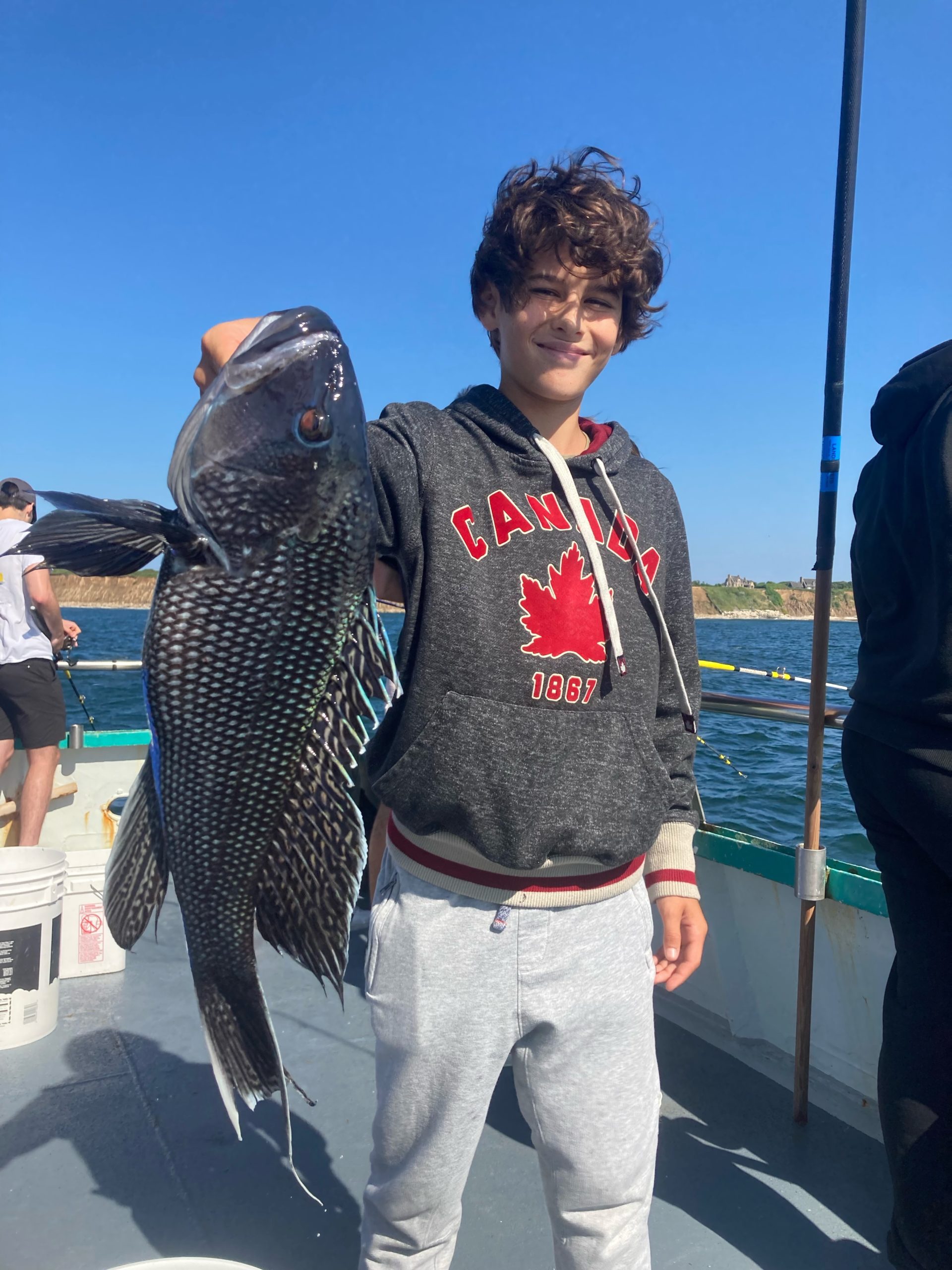 a man holding a fish