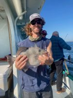 a person holding a fish