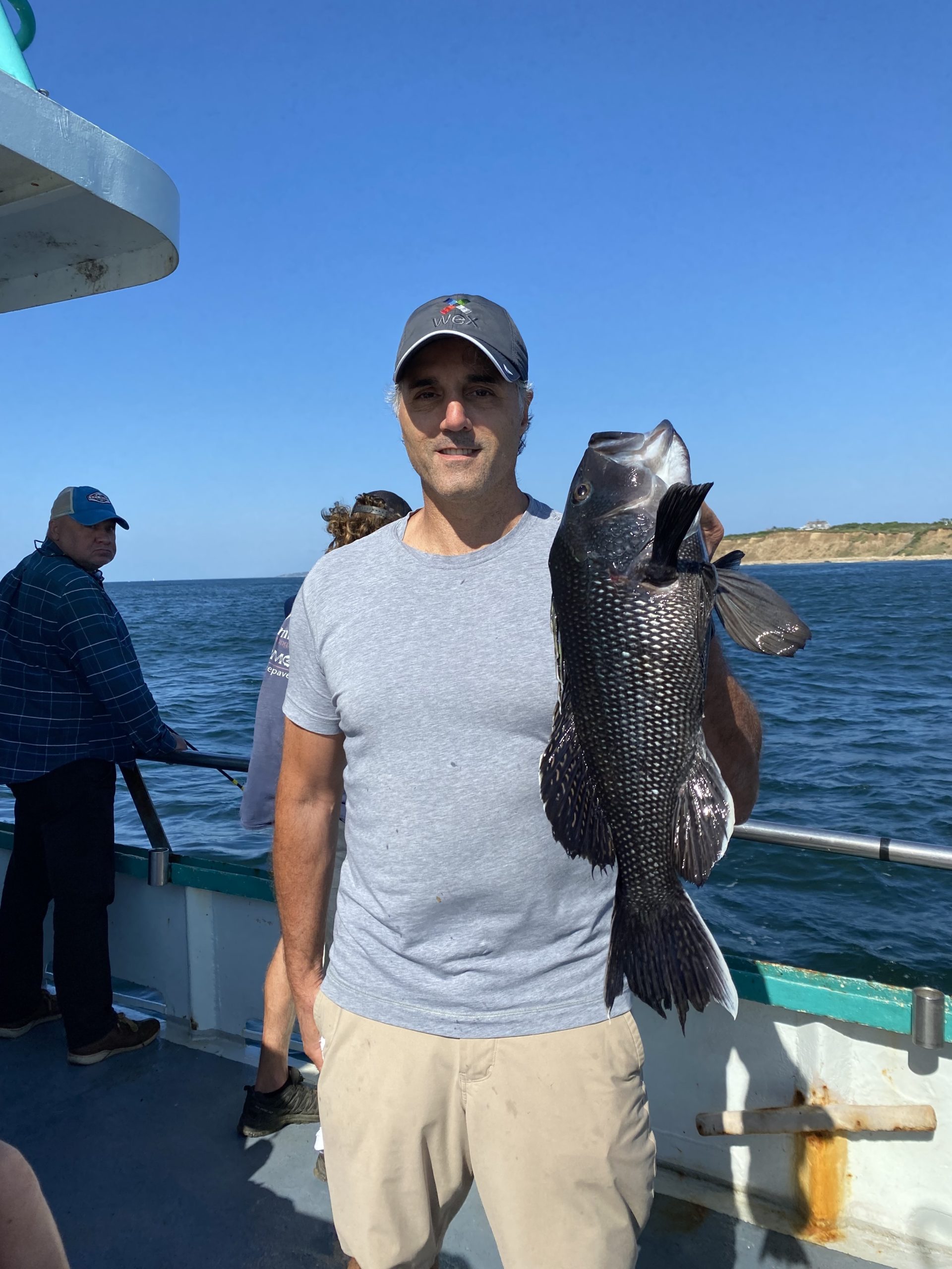 a person holding a fish in the water