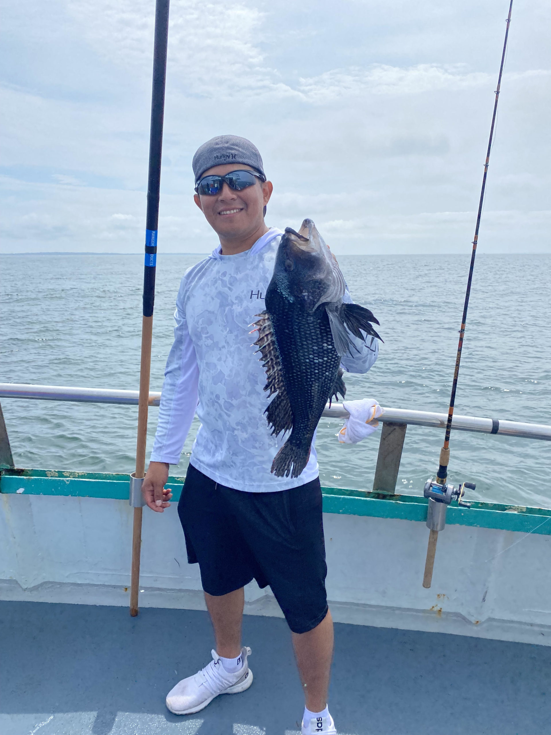 a man holding a fish in the water