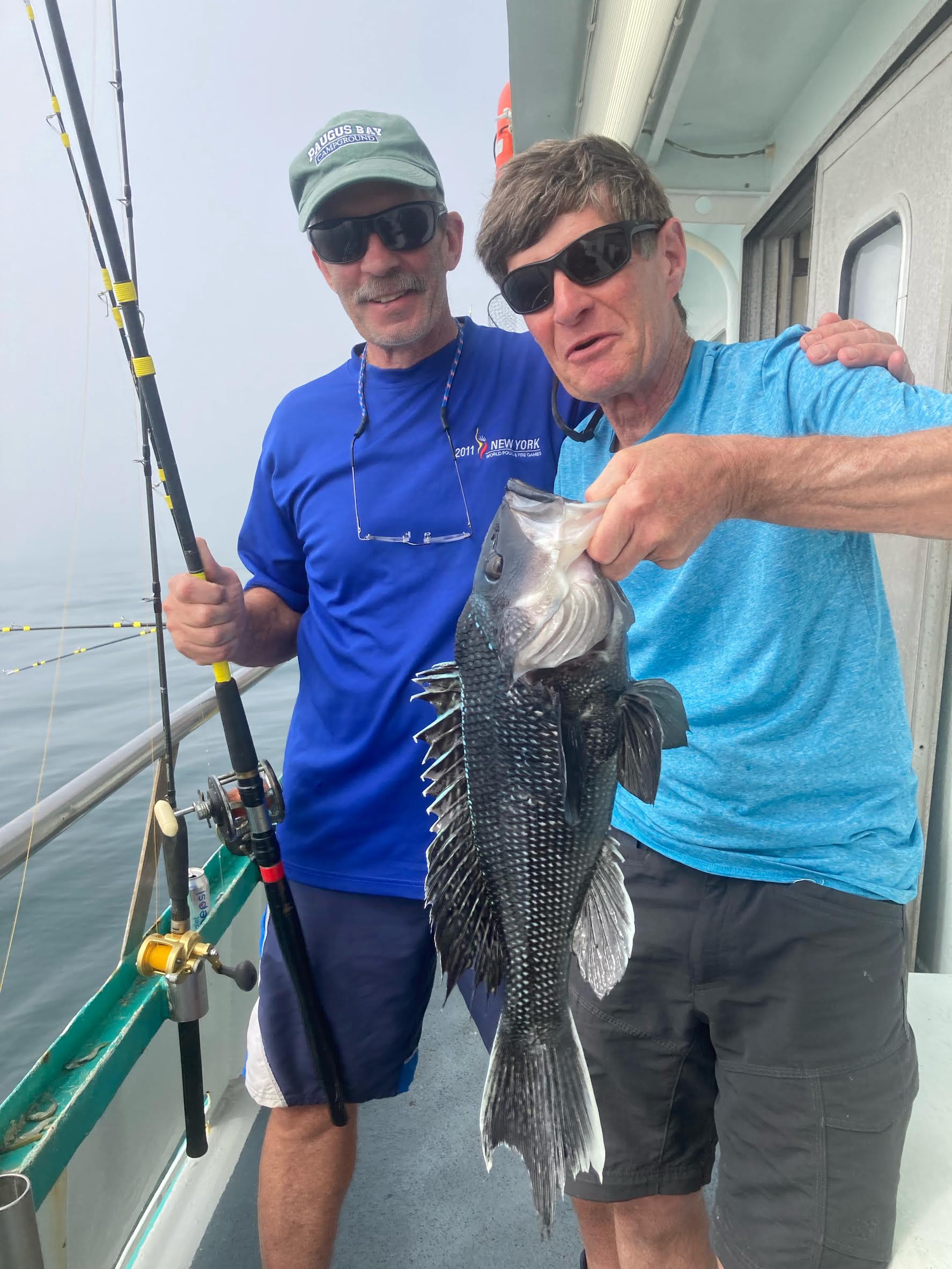 a man holding a fish