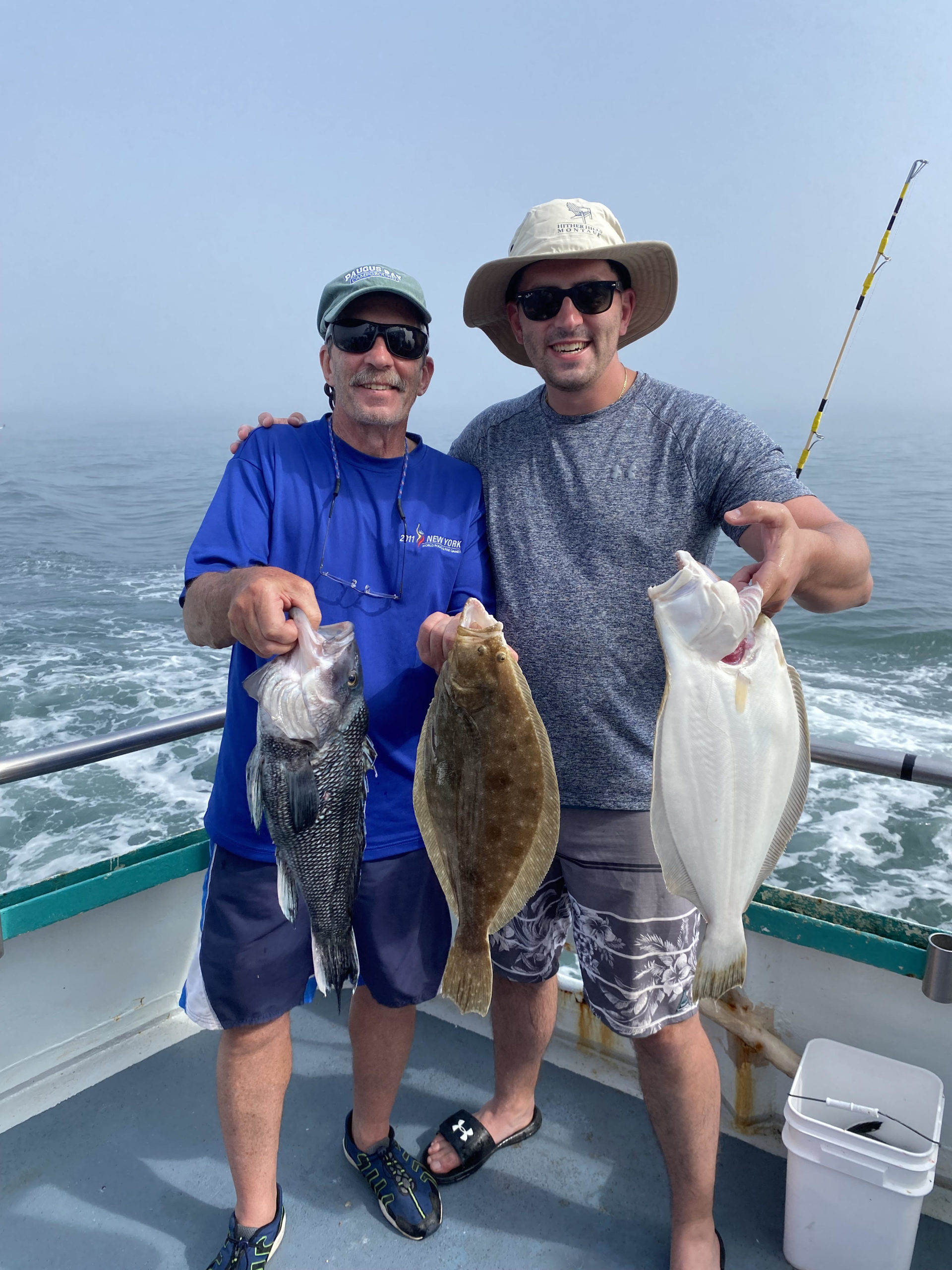 a person holding a fish in the water