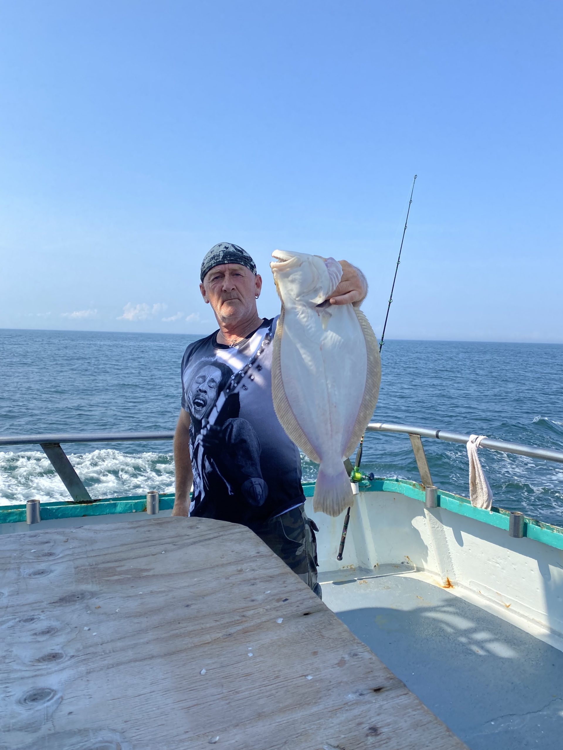 a man sitting on a boat in the water