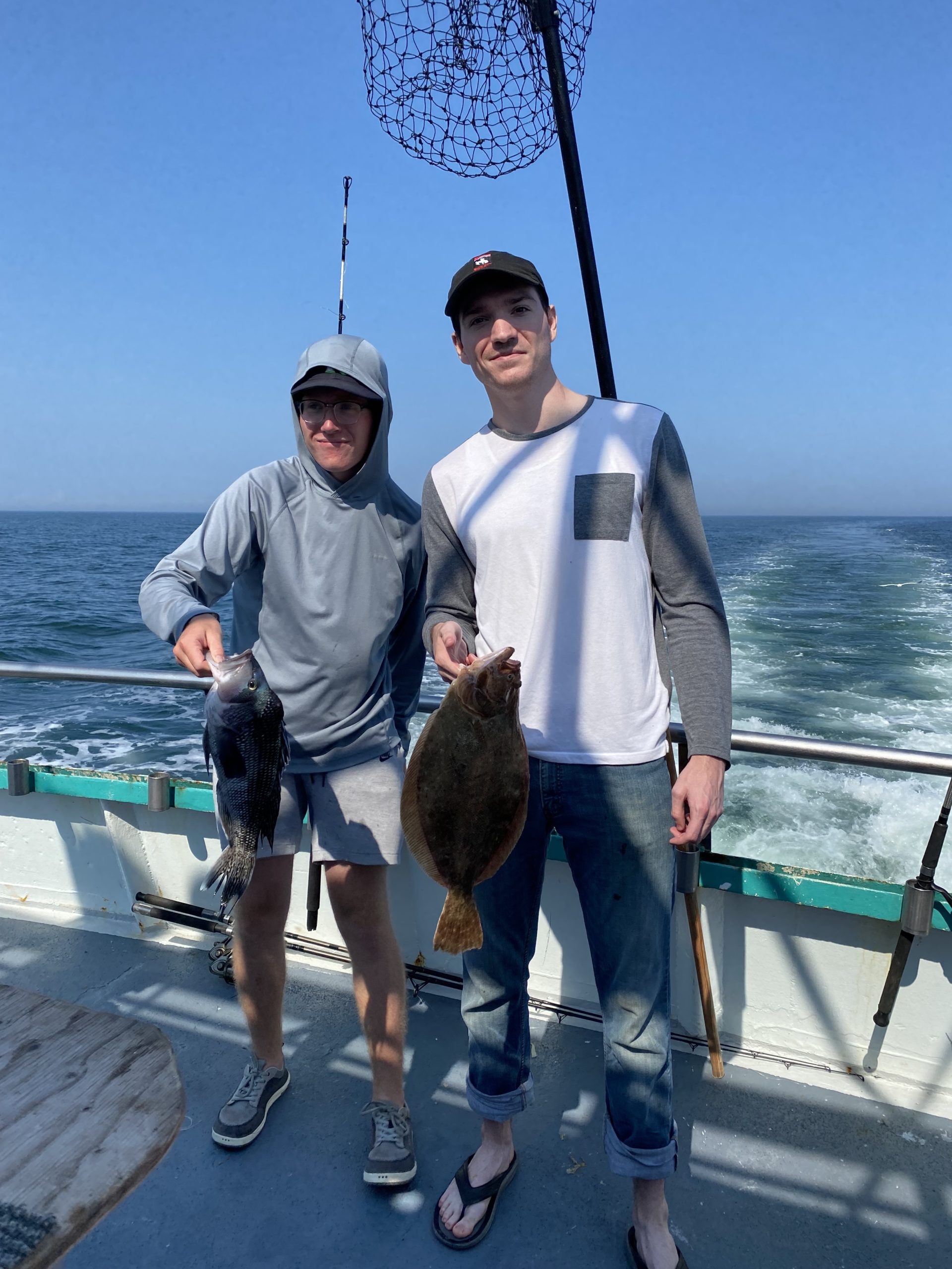 a person holding a fish in the water