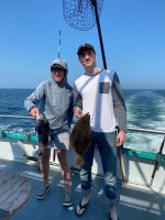 a person holding a fish in the water