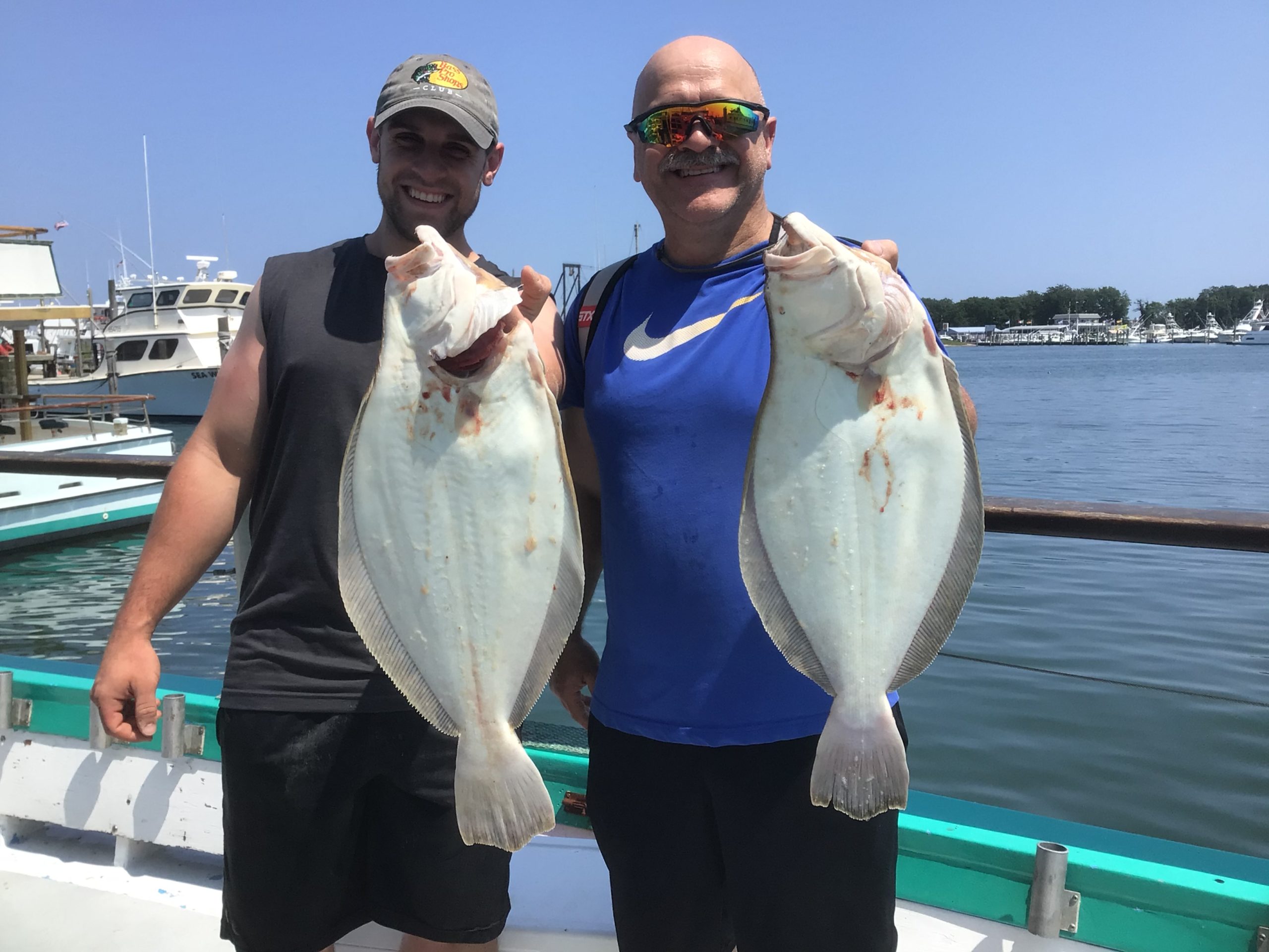 a person holding a fish in the water