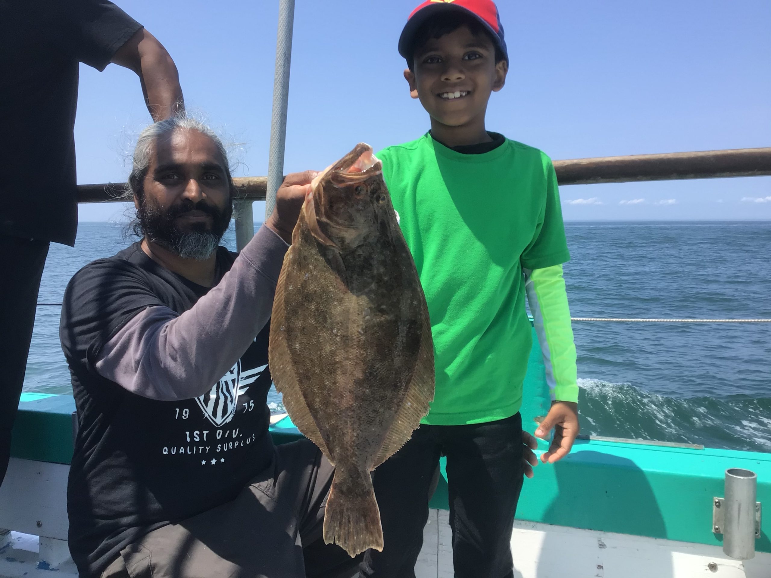 a man holding a fish in the water