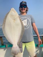 a person holding a fish