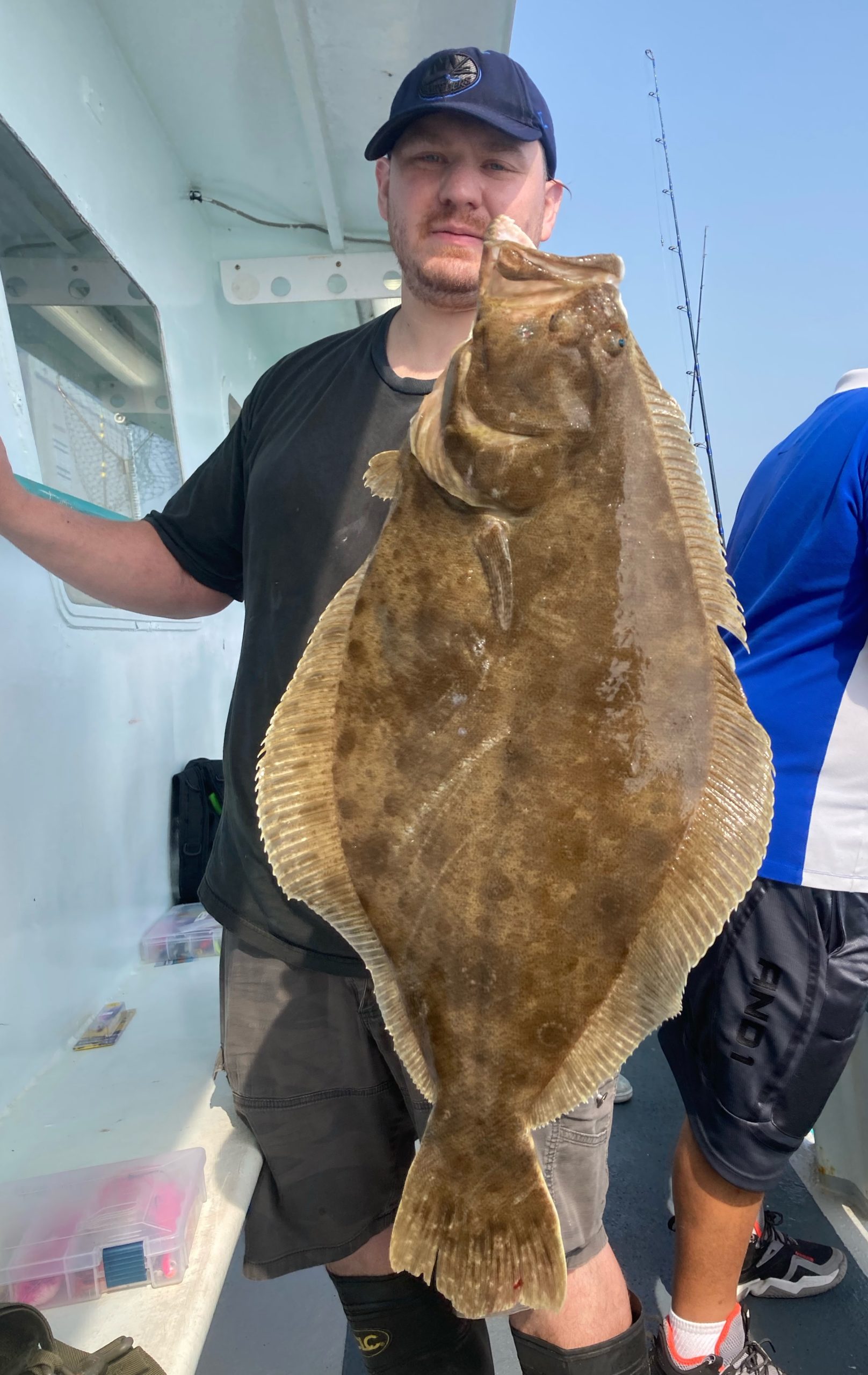 a man holding a fish