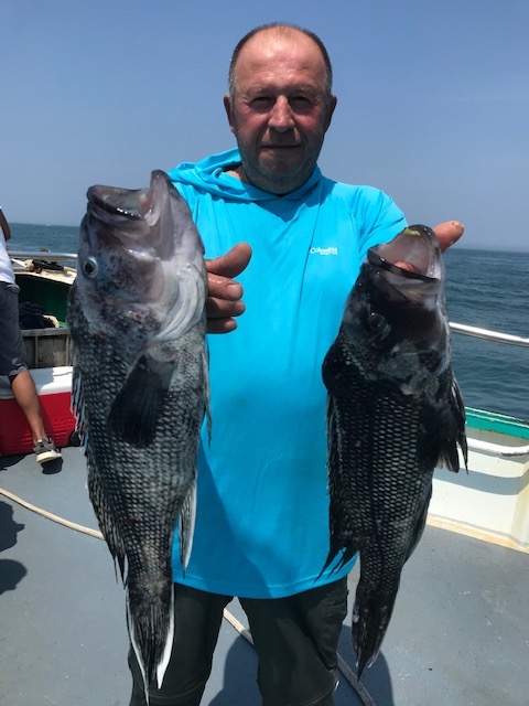 a man holding a fish