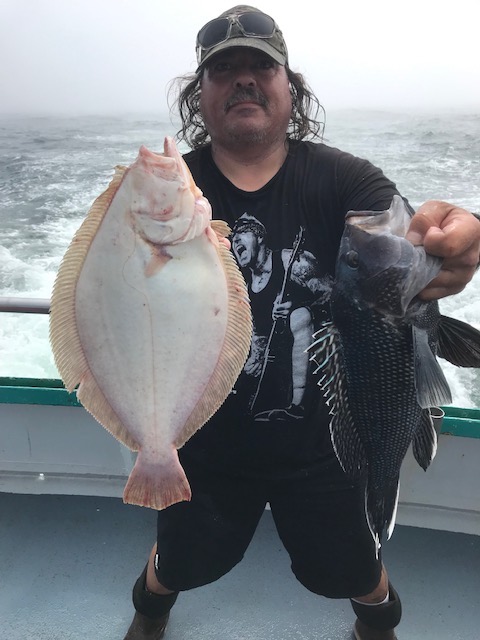 a person holding a fish