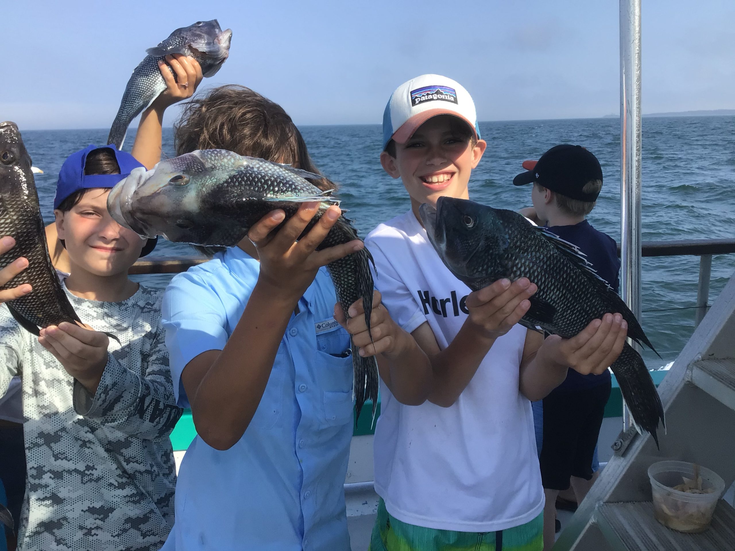 a man holding a fish in the water