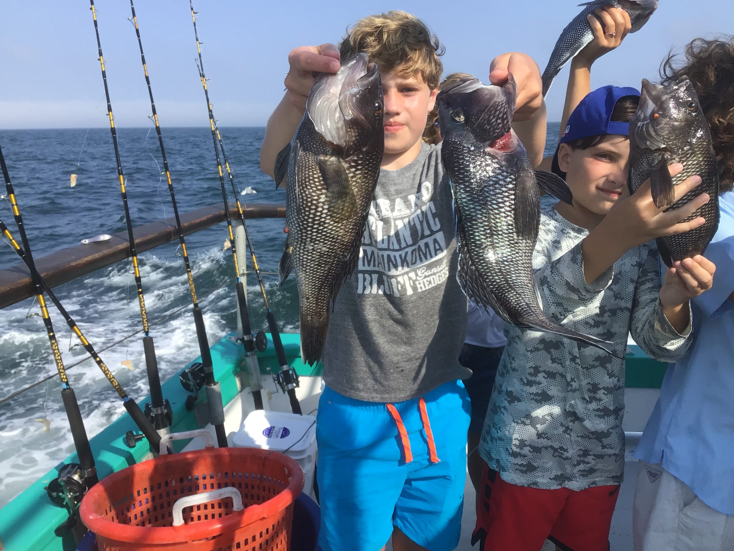 a man and a woman standing next to a body of water