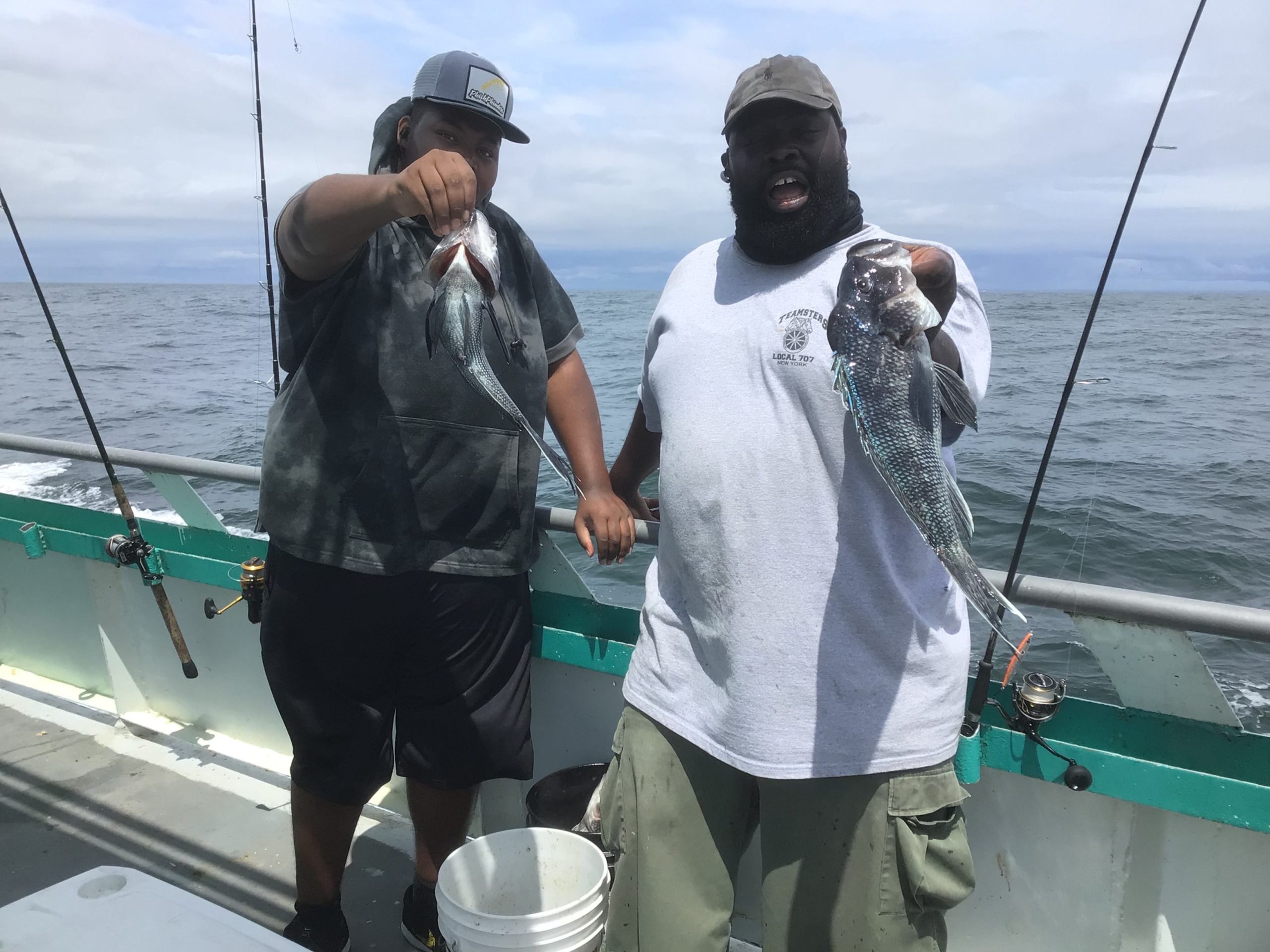 a couple of people that are standing in the water