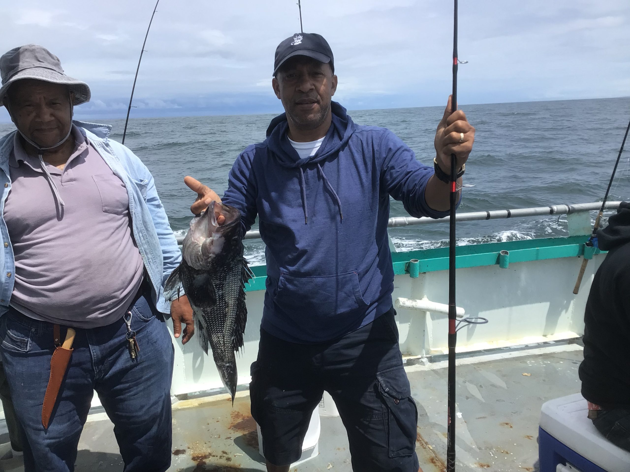 a person holding a fish in the water
