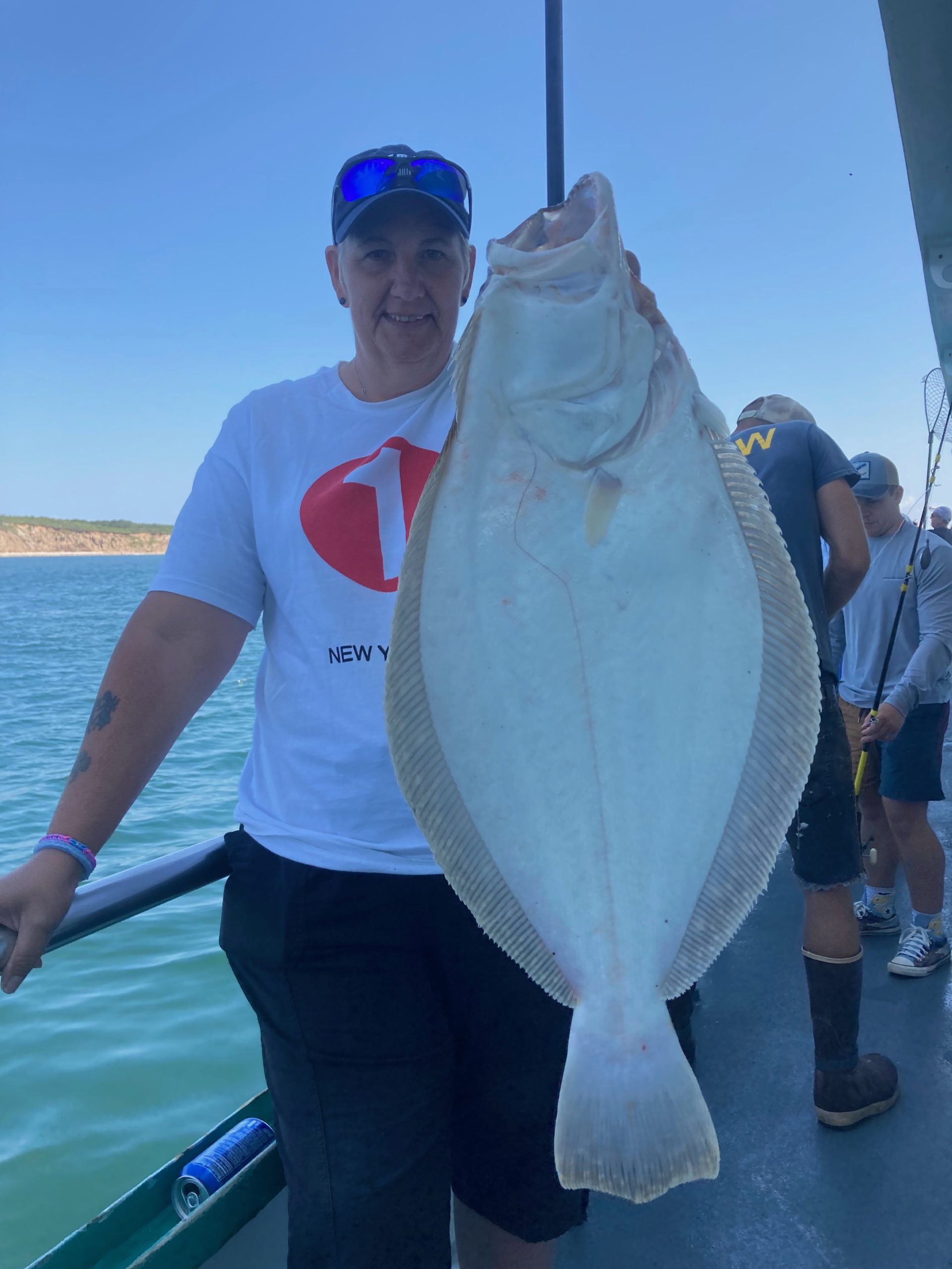 a person holding a fish in the water