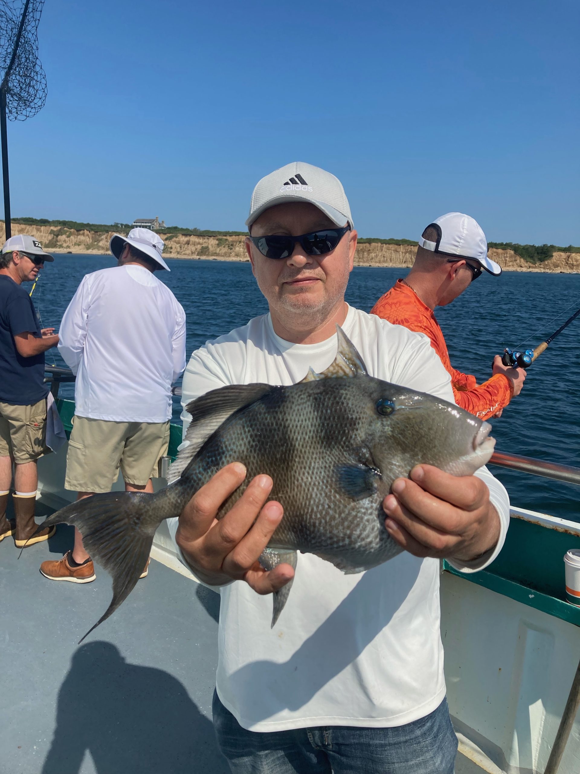 a person holding a fish in the water