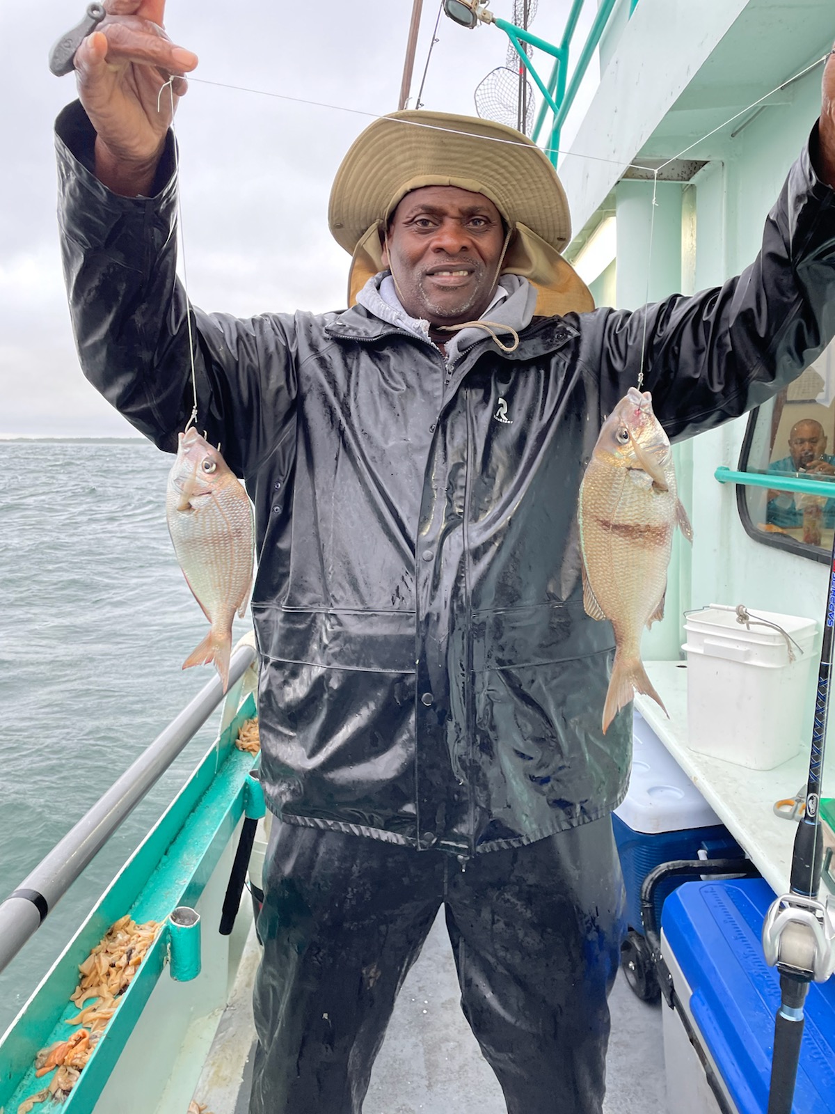 a couple of people that are standing in the water