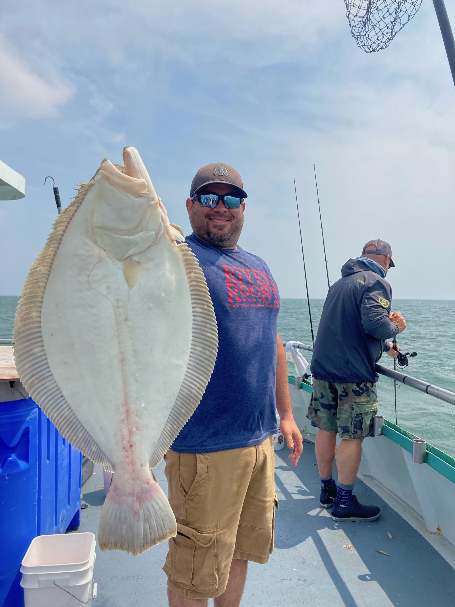 a man holding a fish
