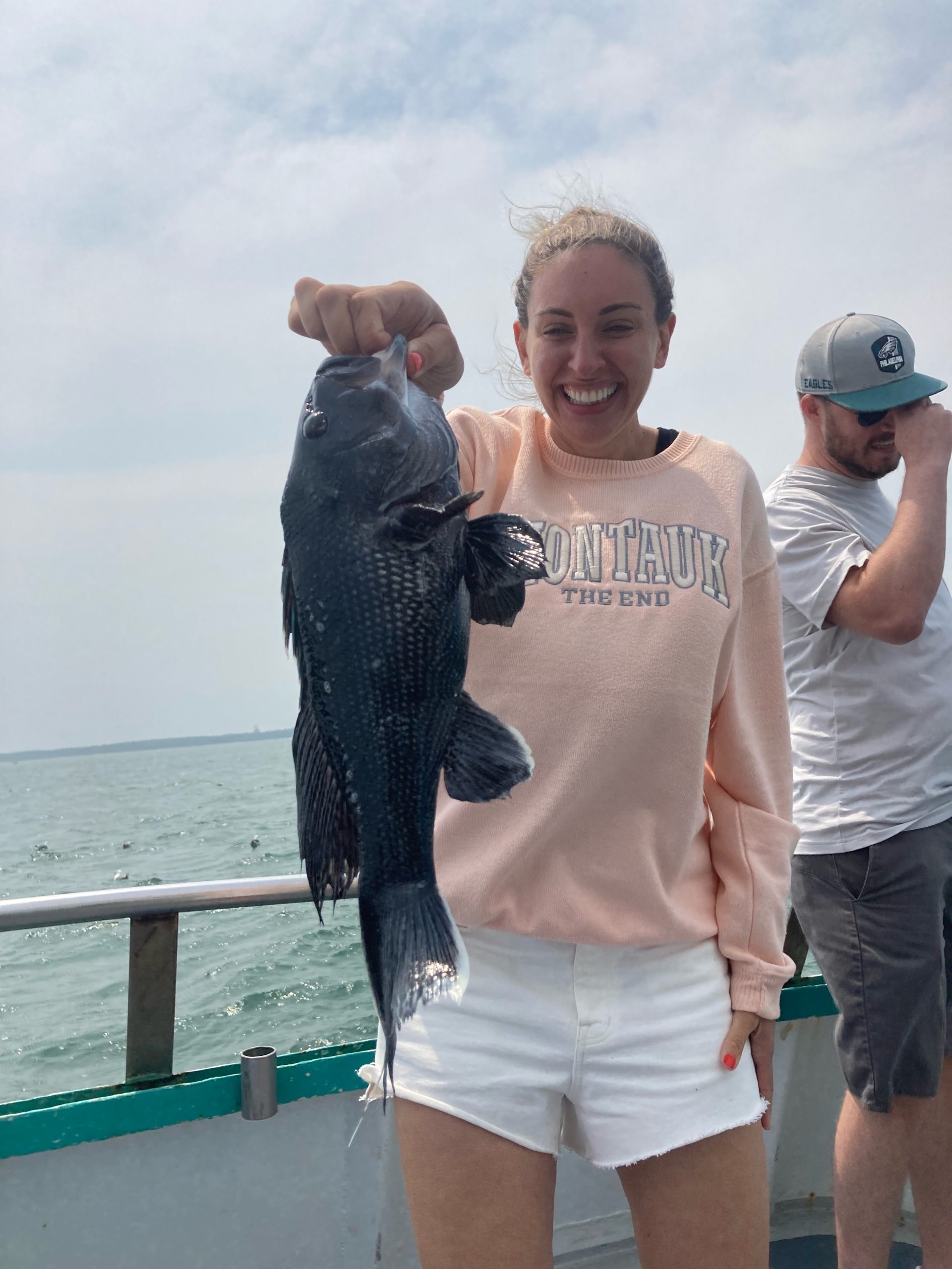a person holding a fish in the water