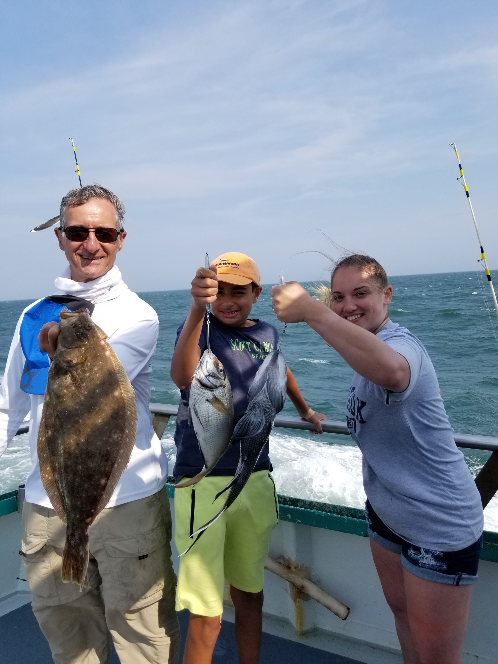 a person holding a fish in the water