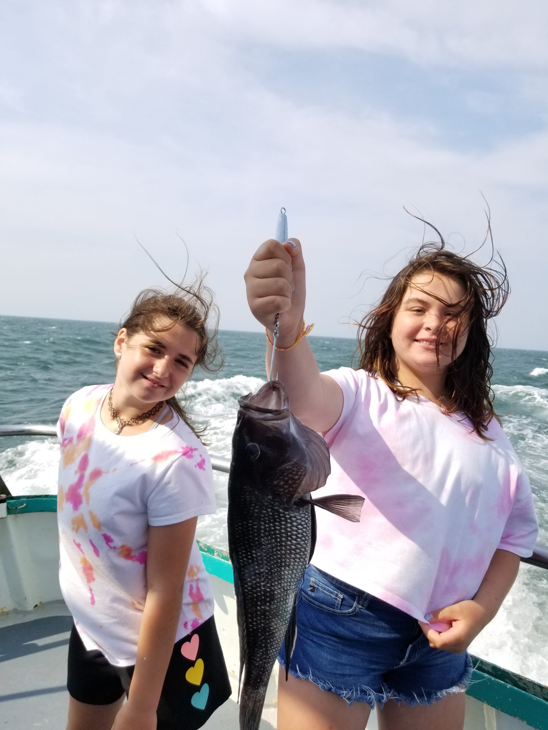 a person holding a fish in the water