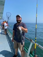 a man standing on a boat in the water