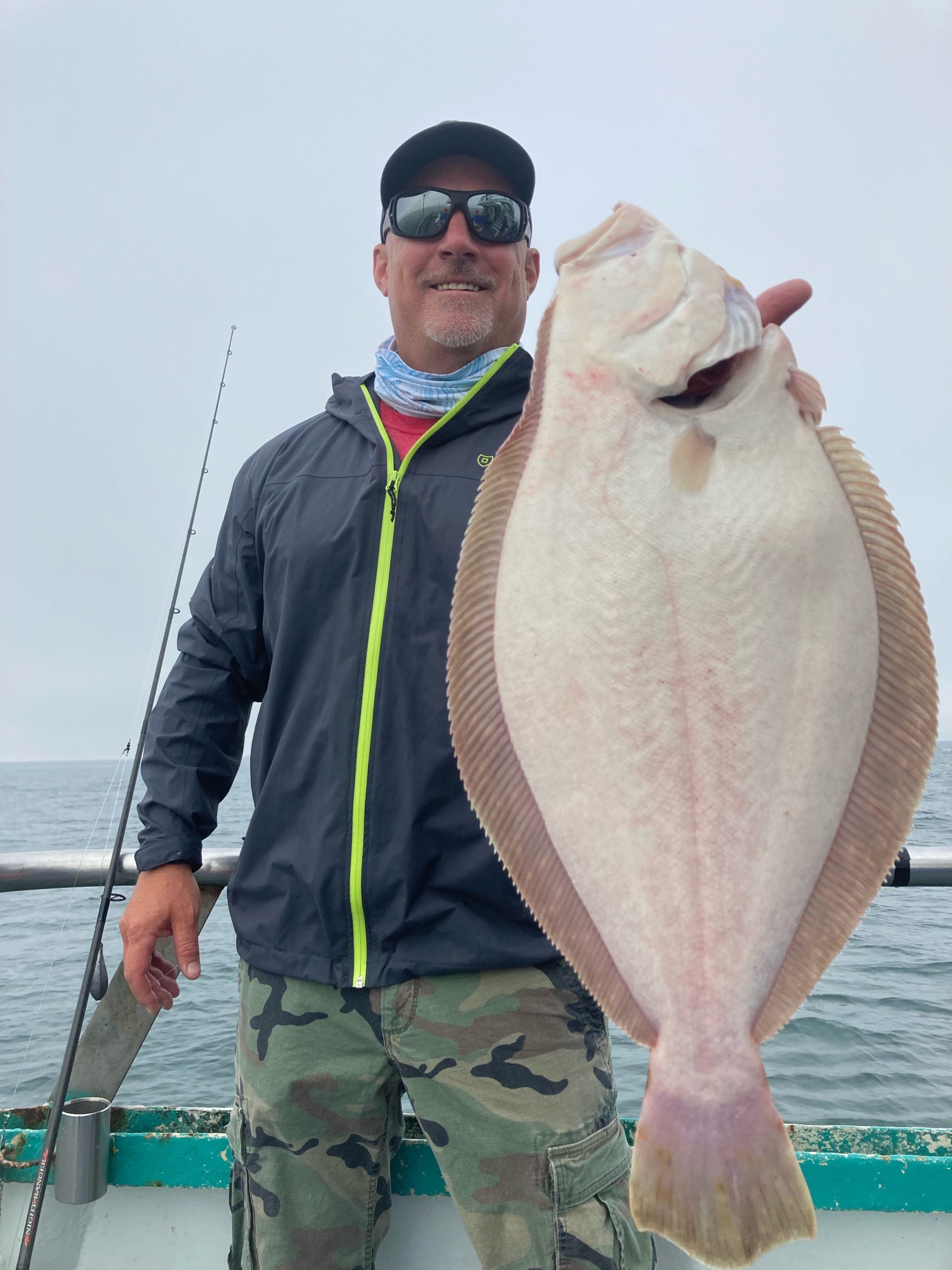 a man holding a fish