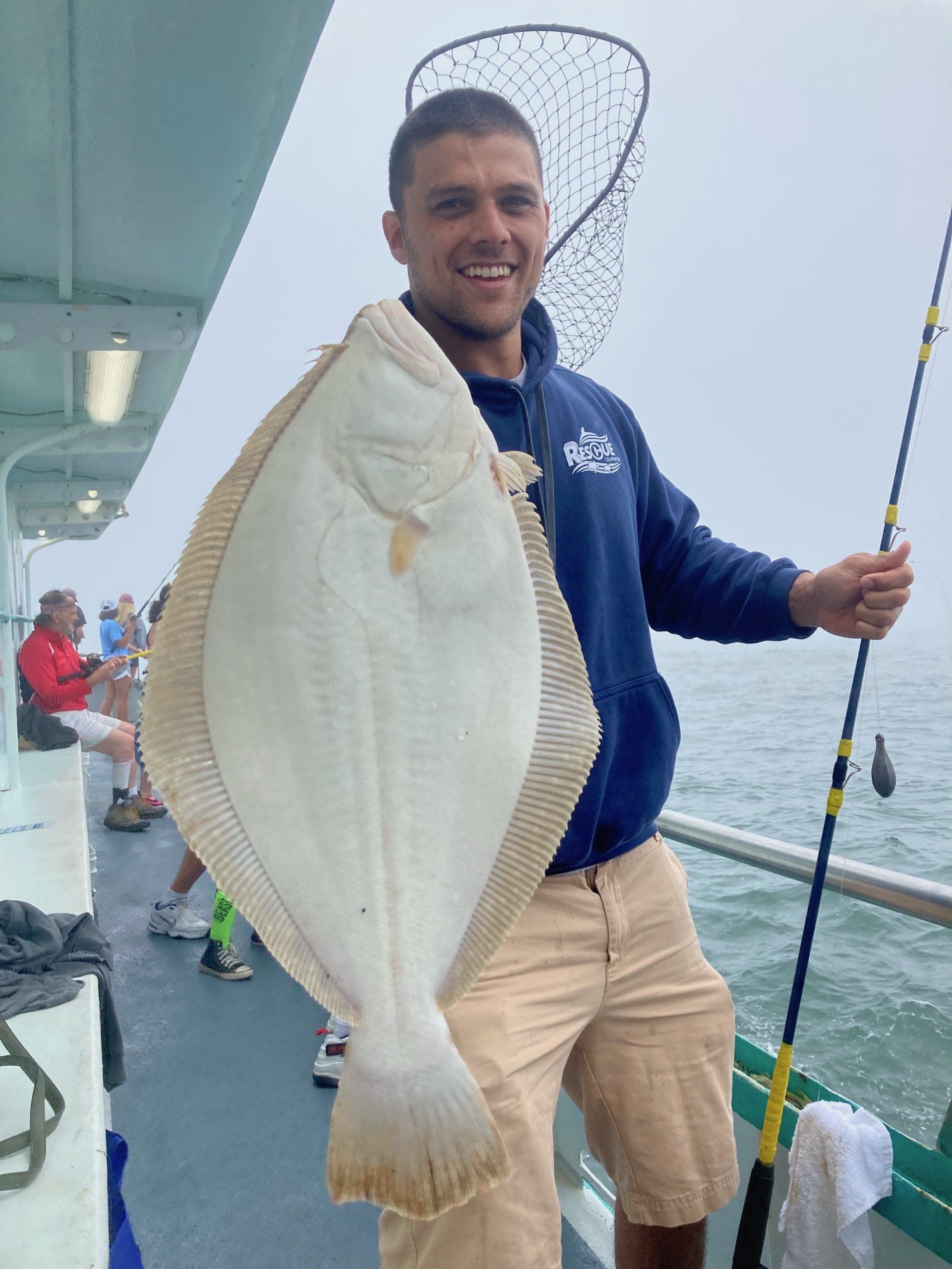a man holding a fish