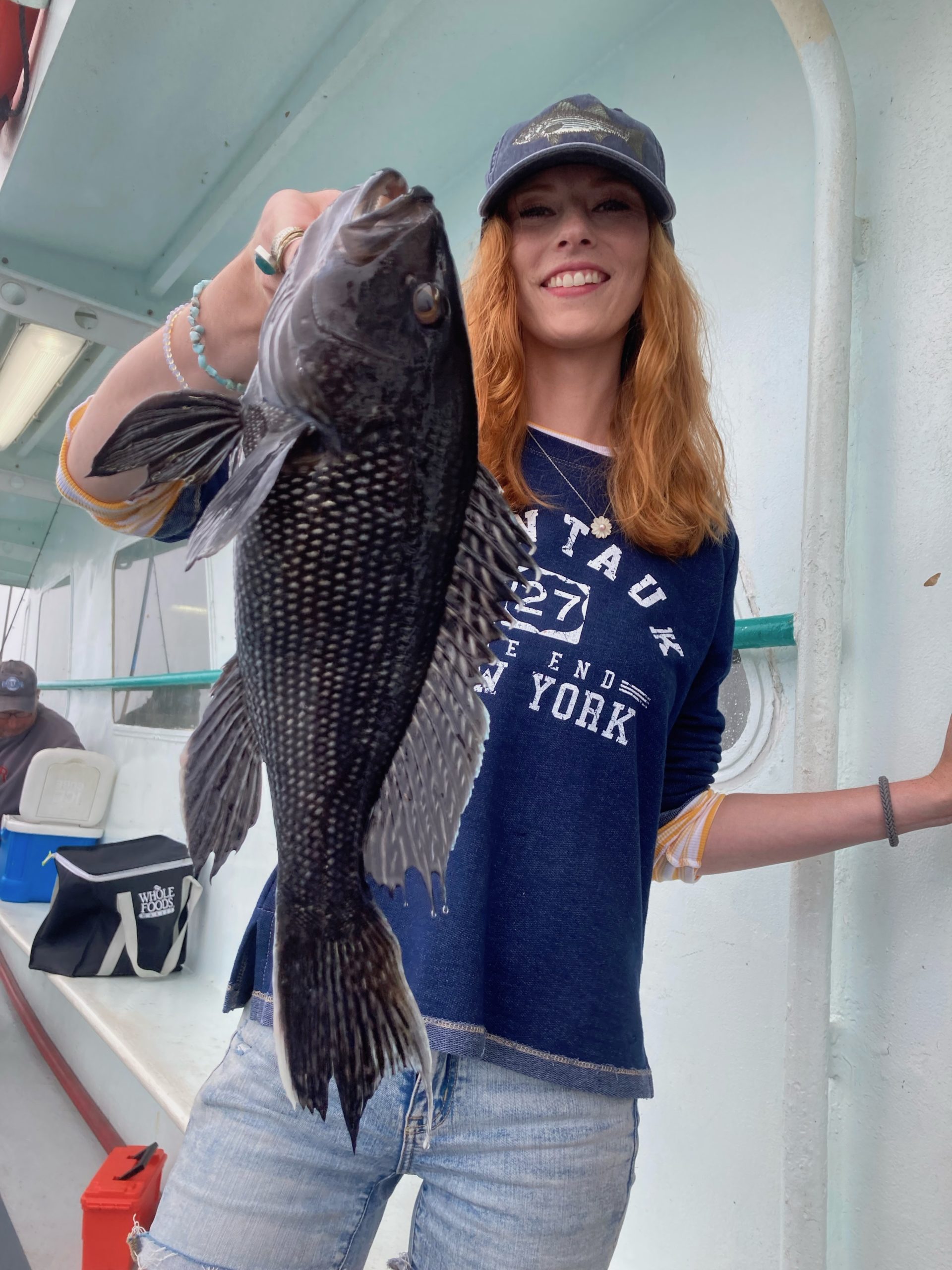 a person holding a fish