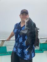 a person holding a fish