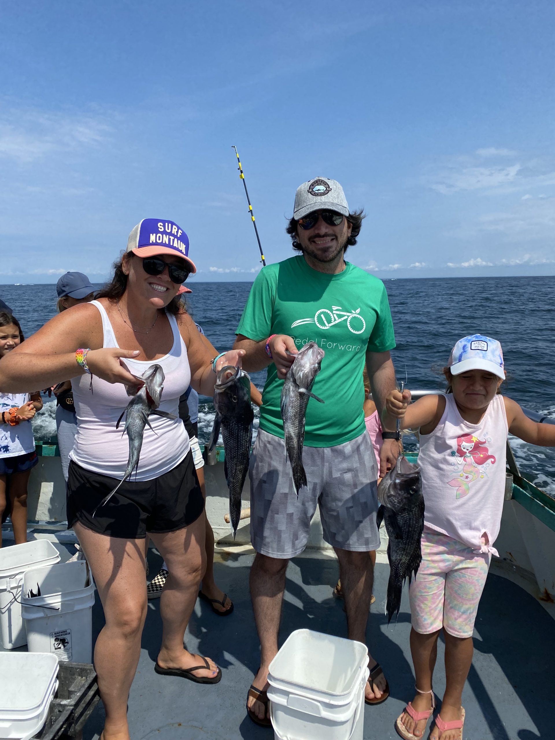 a group of people standing on a boat