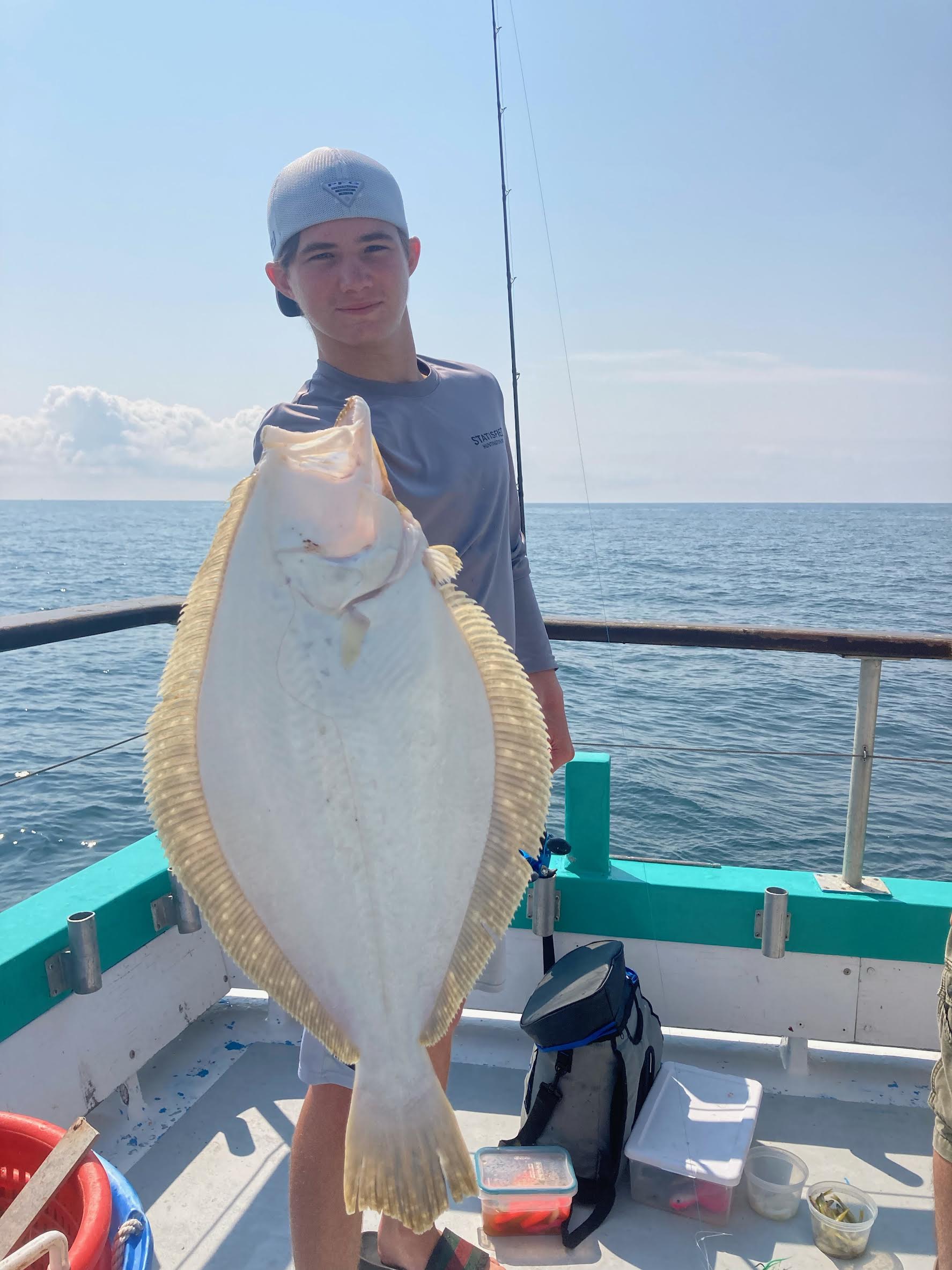 a person standing in front of a body of water