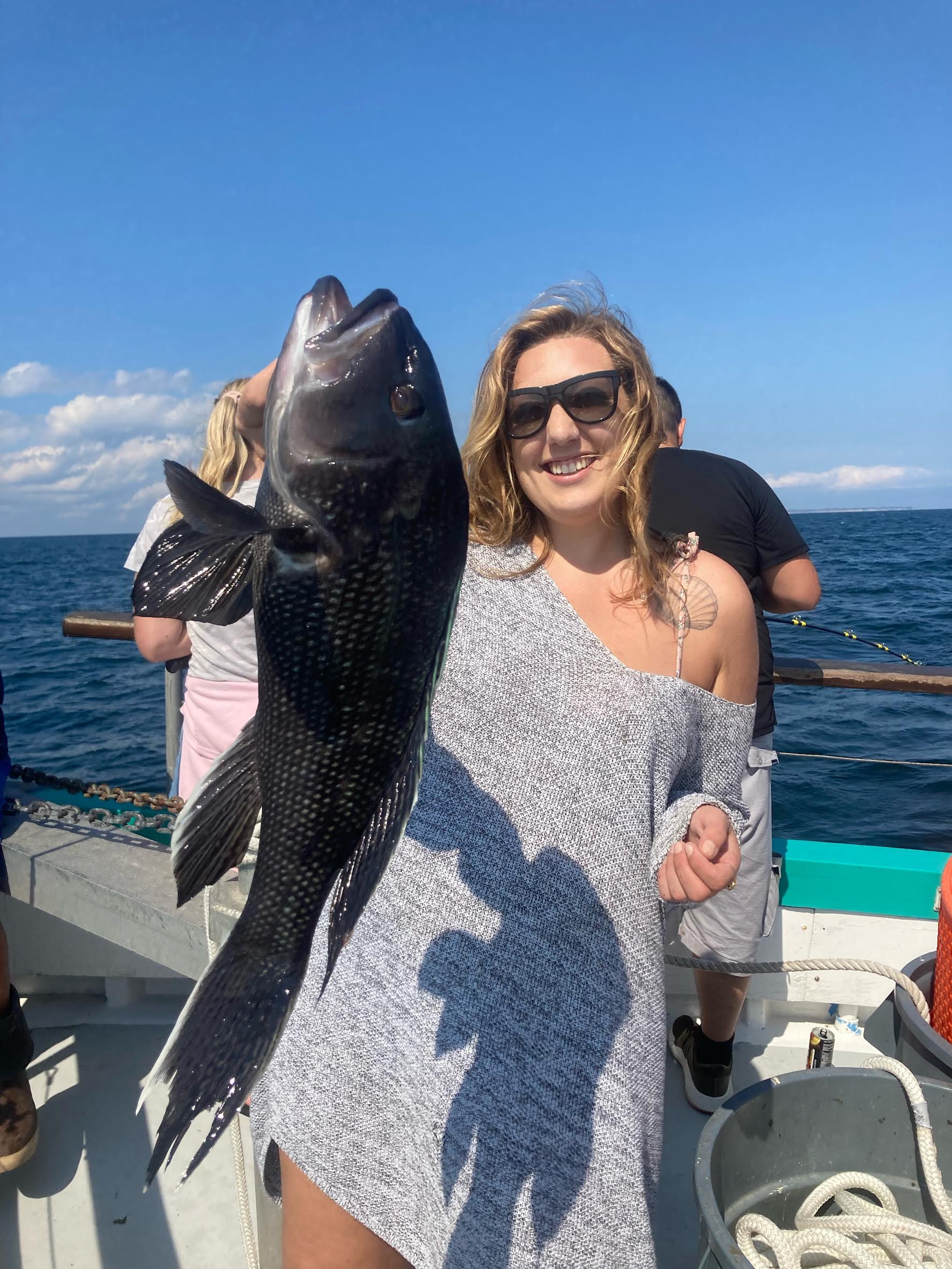 a person holding a fish in the water